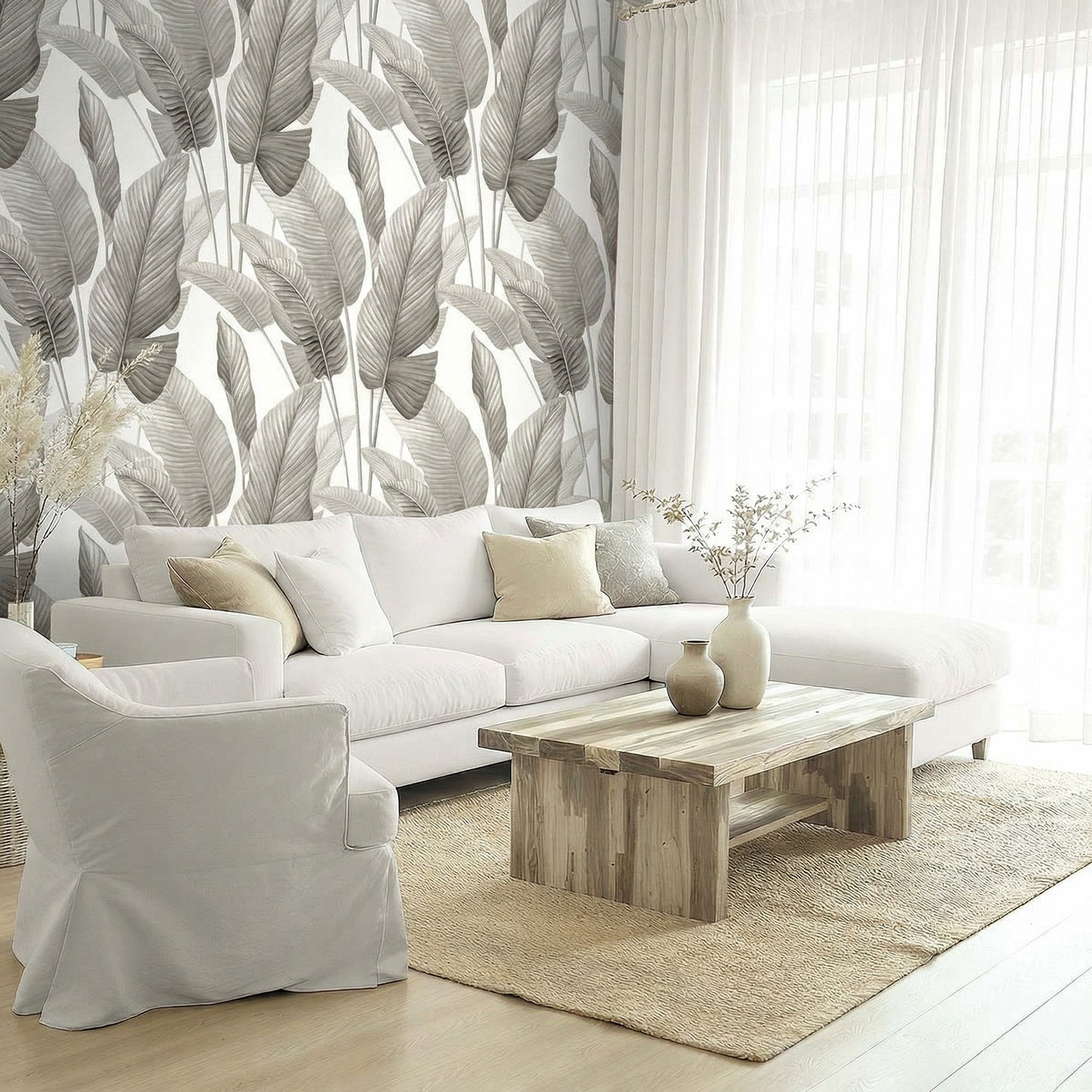 Bright living room with a white sofa, light wood table, Lace Leaf Wallpaper, and sheer curtains.