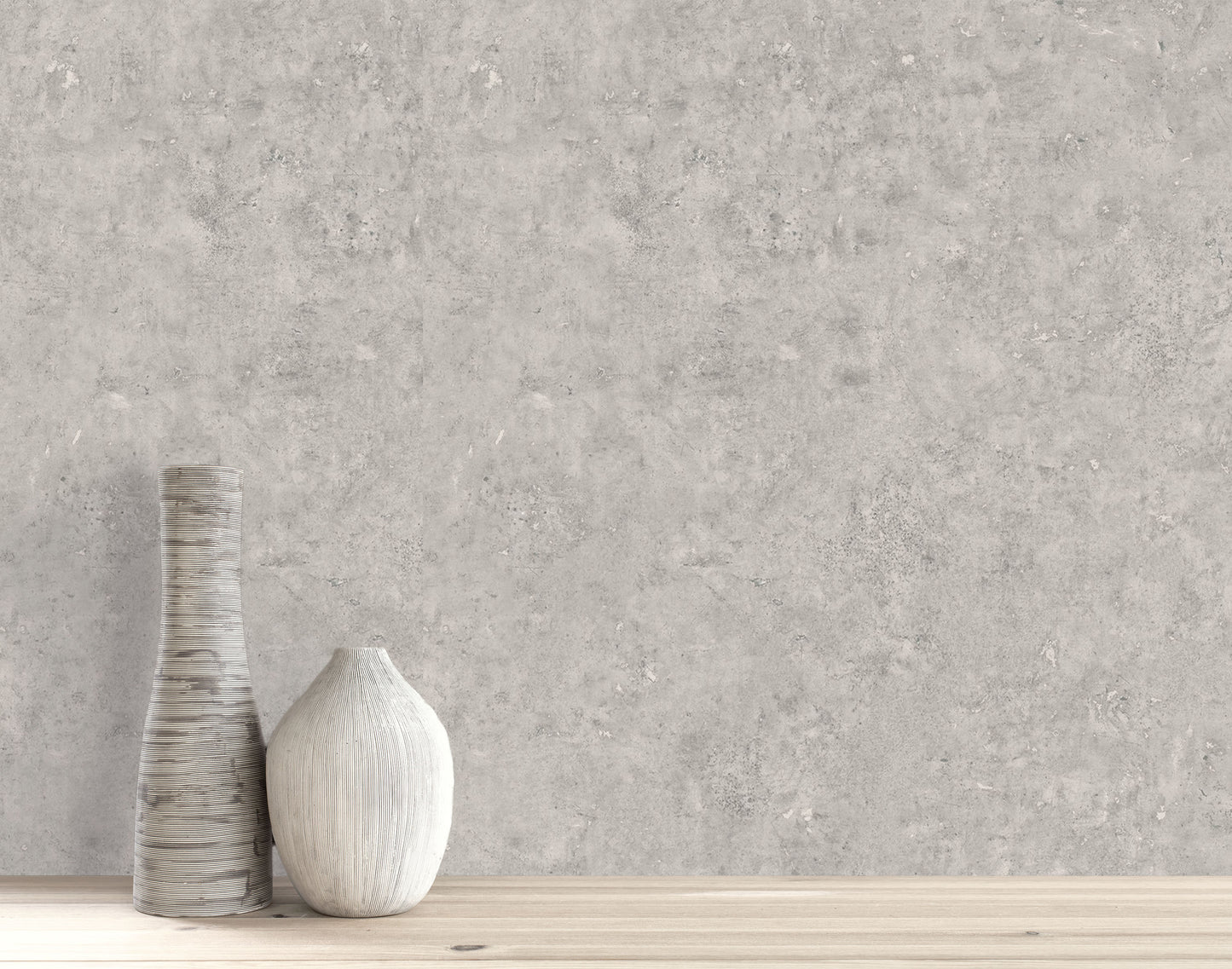 Two neutral-toned ceramic vases on wood, set against Cement Commercial Vinyl light grey concrete faux wallpaper.