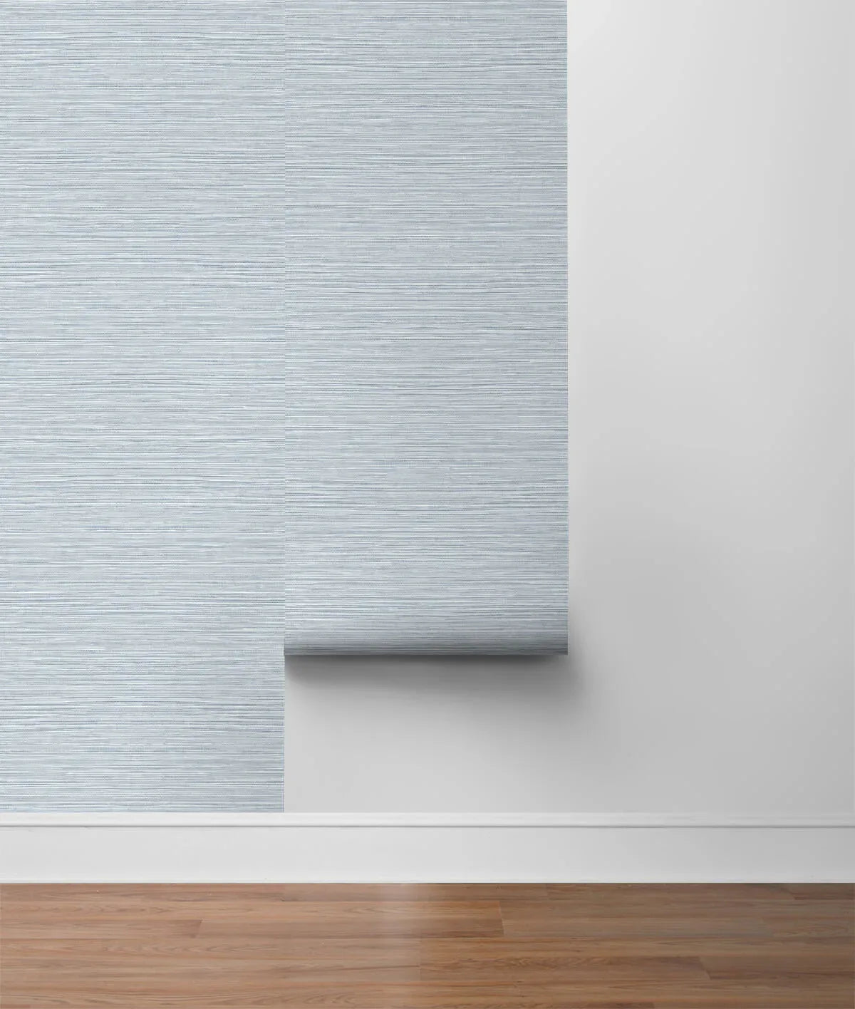 Faux Sisal Peel Stick wallpaper in blue and white stripes is applied to a white wall above a wooden floor.