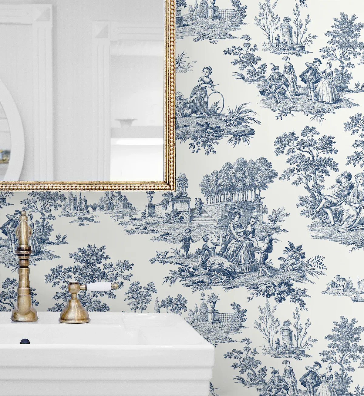 A bathroom sink and mirror with Toile de Jouy Peel Stick wallpaper in blue pastoral scenes on a white background.
