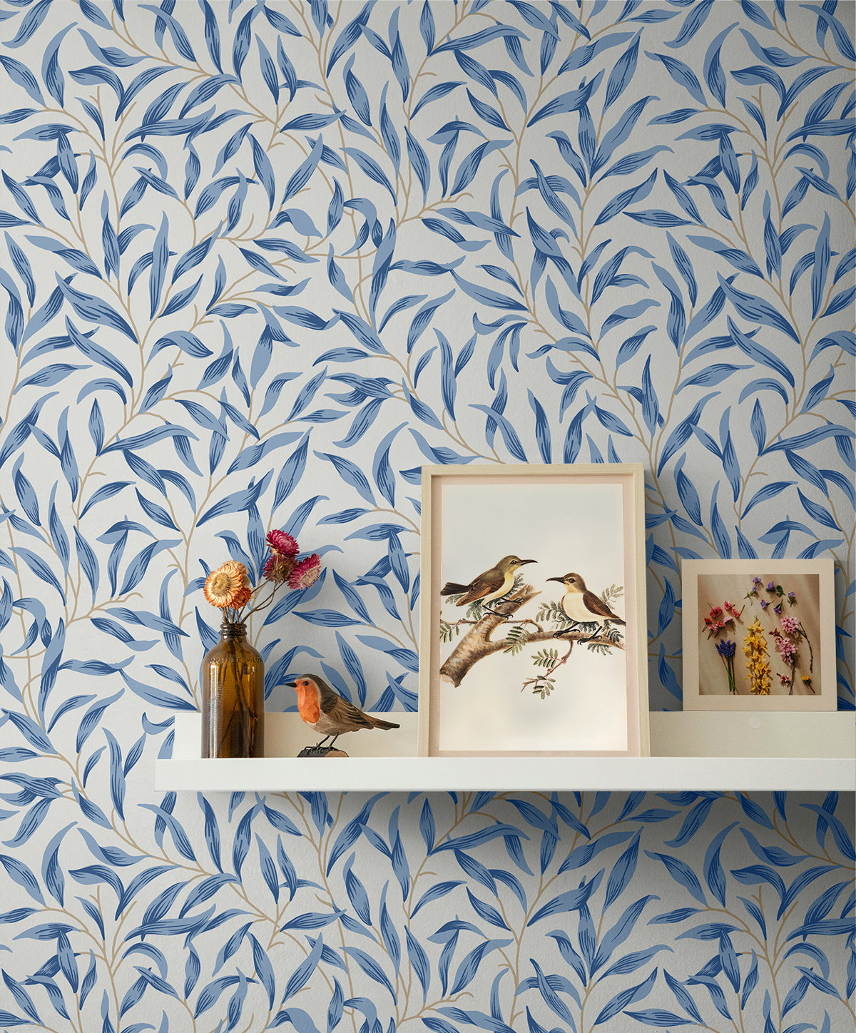 Wall with Blue Leafy Branches Peel & Stick Casa Mia Wallcovering, shelf with decorative items against the wall