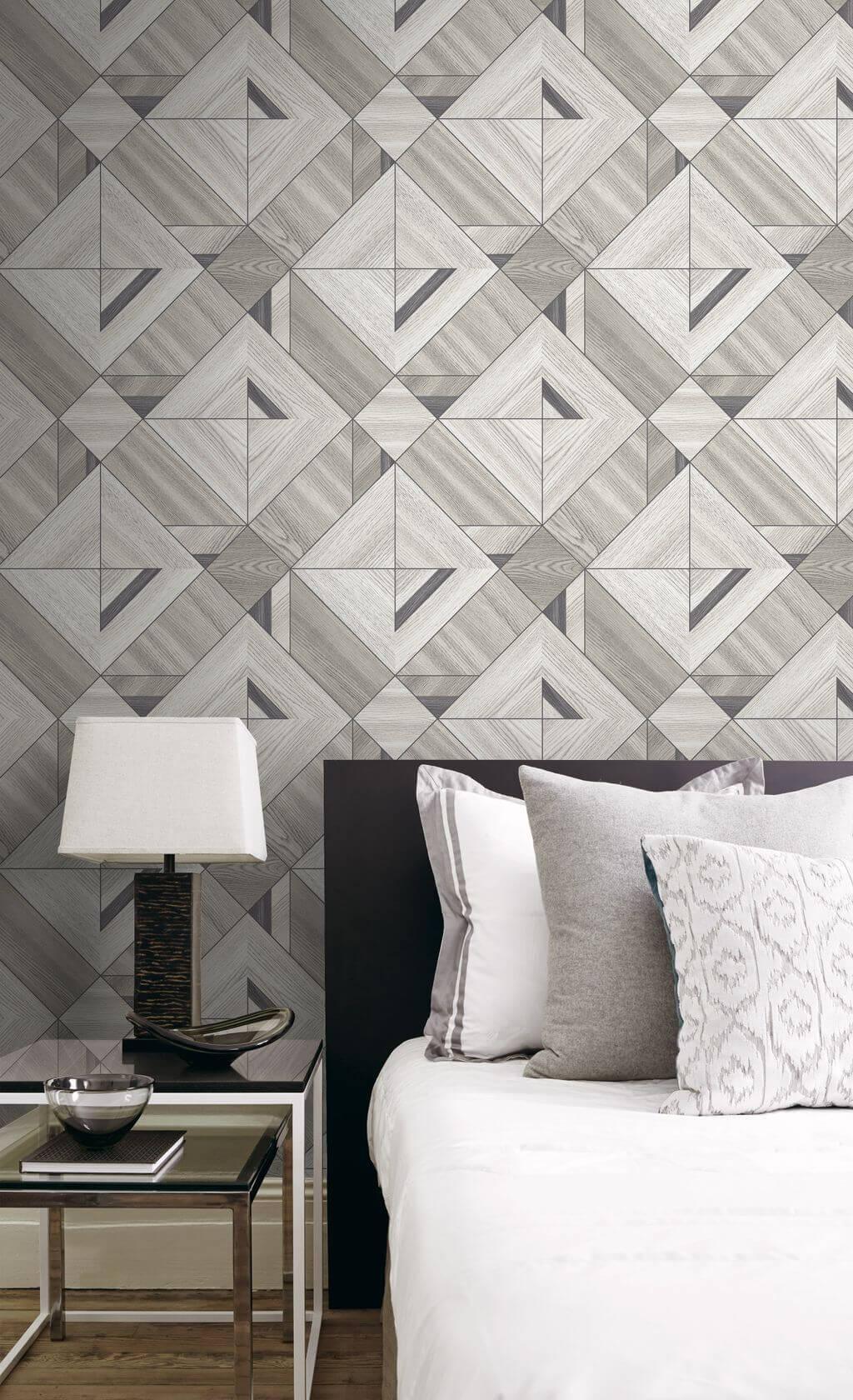 Modern bedroom with Wood Tiles Wallpaper, black headboard, white bedding, and a table lamp on a side table.