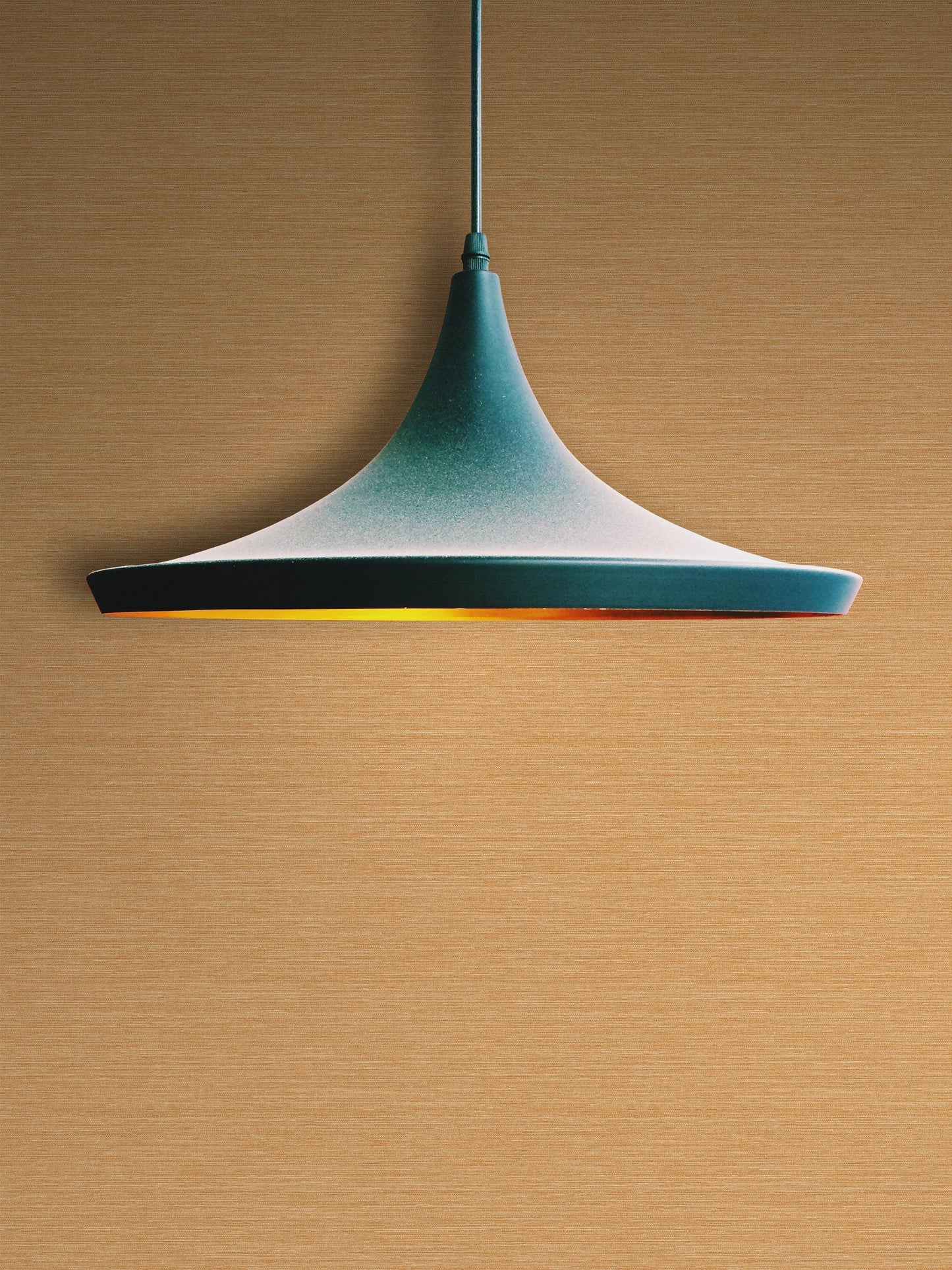 A modern black pendant lamp hangs from the ceiling against a wall with Grasscloth Effect Imitation Wallpaper.