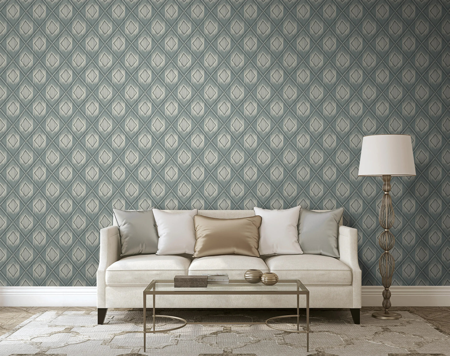 Modern living room with a beige sofa, pillows, glass coffee table, and Ikat Texture Grasscloth Naturals wallpaper.