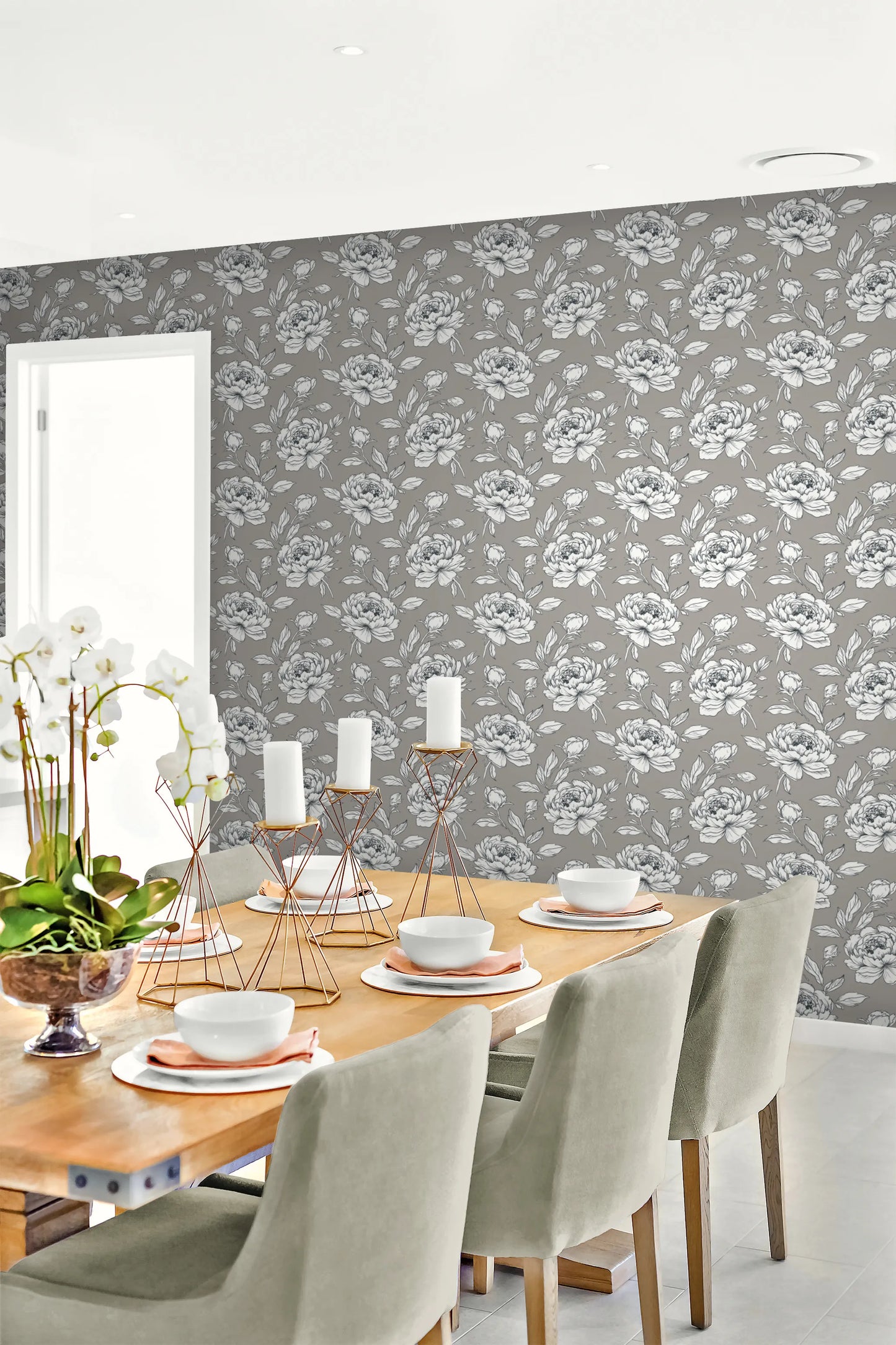 Dining room with wooden table and chairs against a wall decorated with Gray & White & Black Peony Flower Wallpaper.