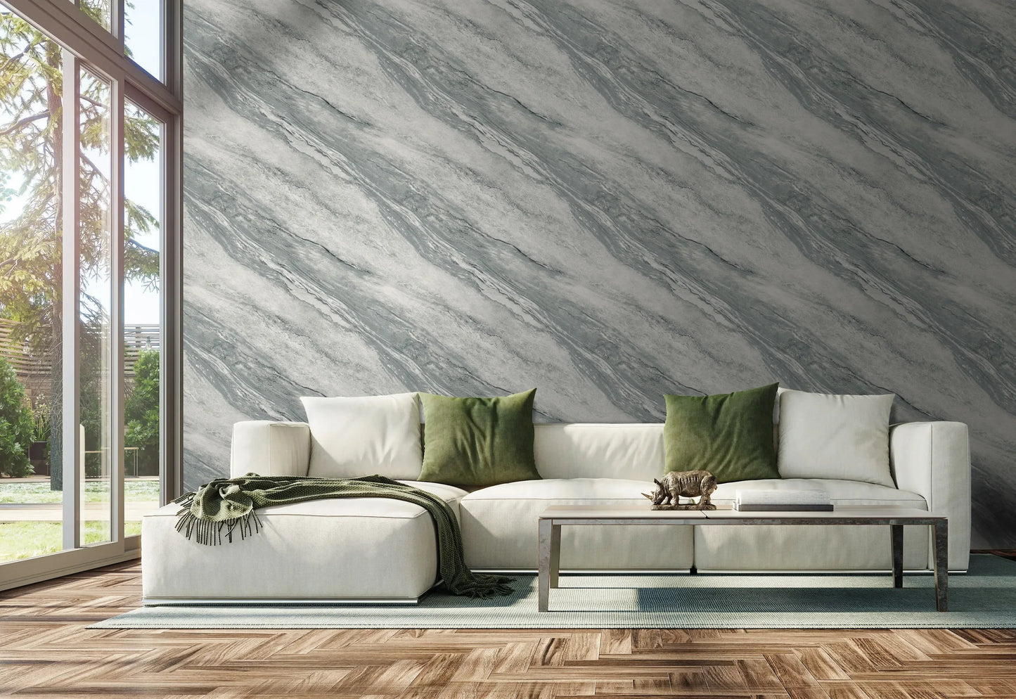 Modern living room with a white sofa, green pillows, glass coffee table, and Marble Commercial Vinyl accent wall.
