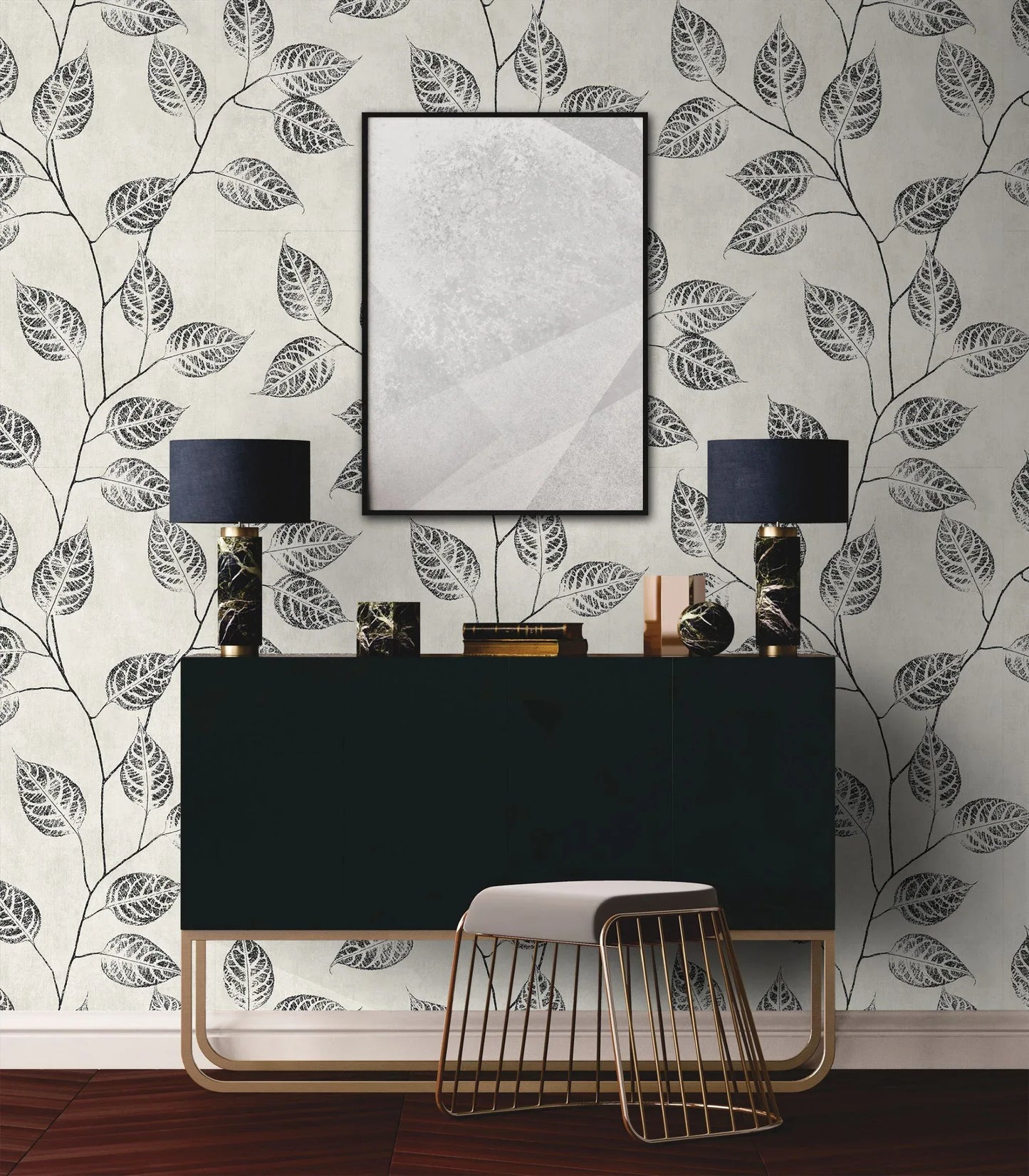 Modern sideboard with black lamps and books against Branch Of Leaves Wallpaper; white stool in front.
