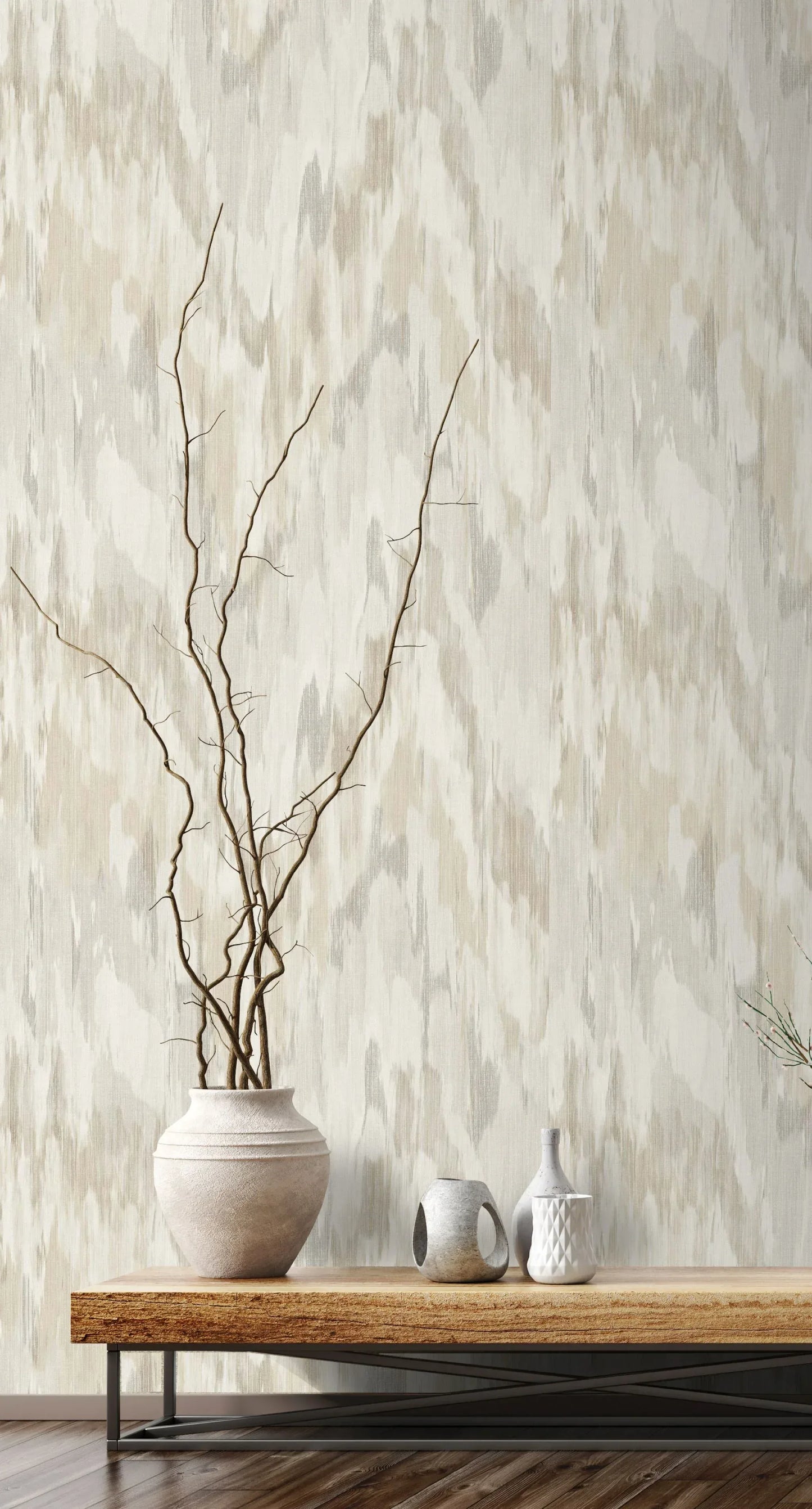Watercolor Wave Wallpaper behind a wooden console with white ceramic vases and bare branches.