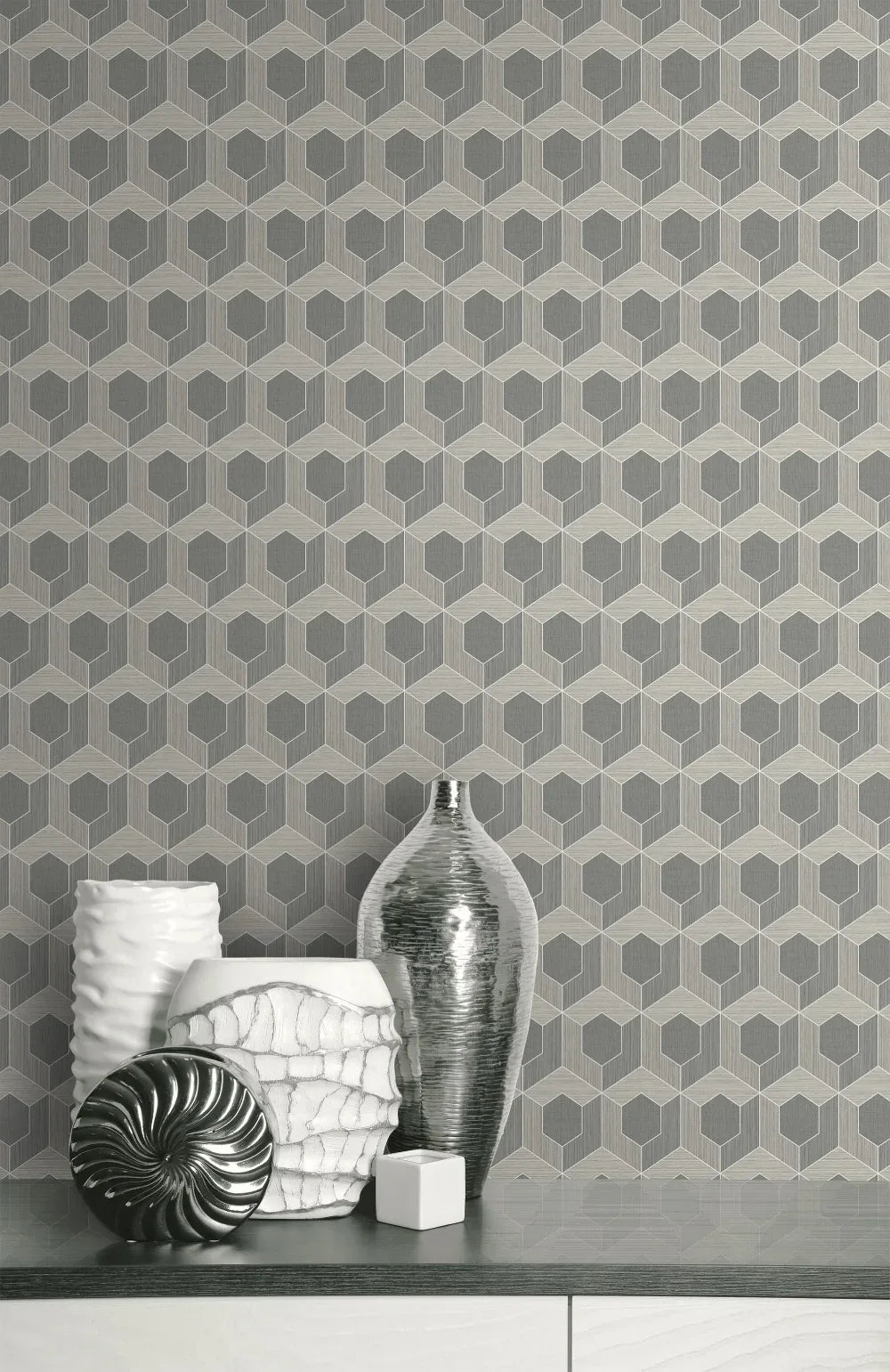Silver and white vases pop on a shelf with contemporary 3D Hexagon Wallpaper in washable, nonwoven material.