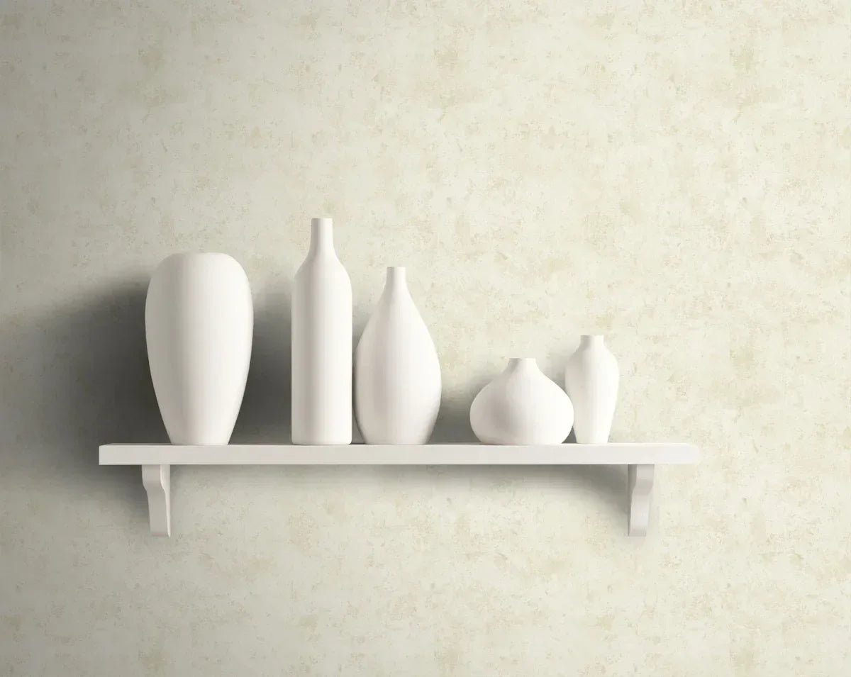 A white shelf with five vases is set against a Soft Marble Wallpaper in a chic designer loft.