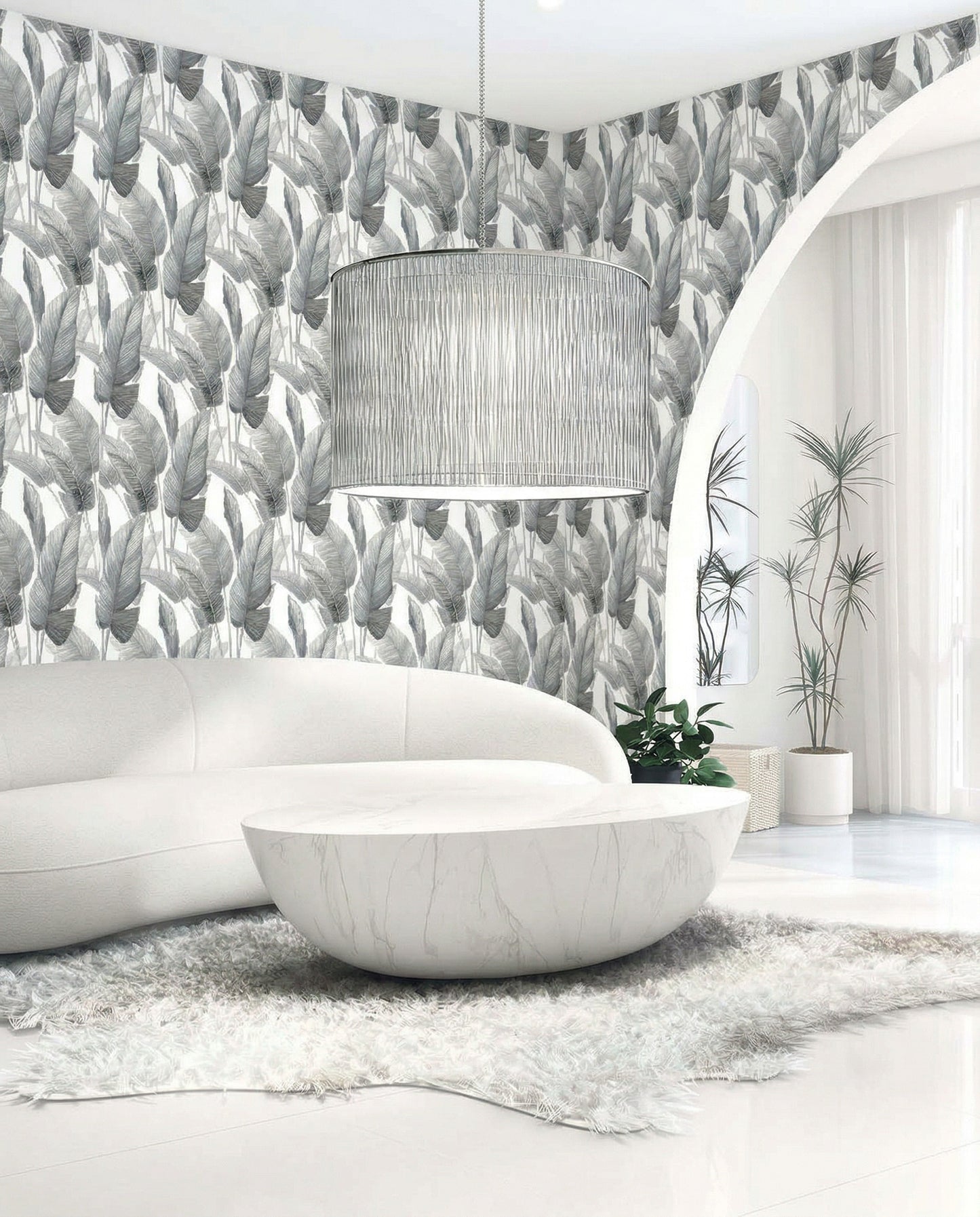 Modern living room with curved white sofa, round marble table, and Lace Leaf Wallpaper in white/off white dark gray.