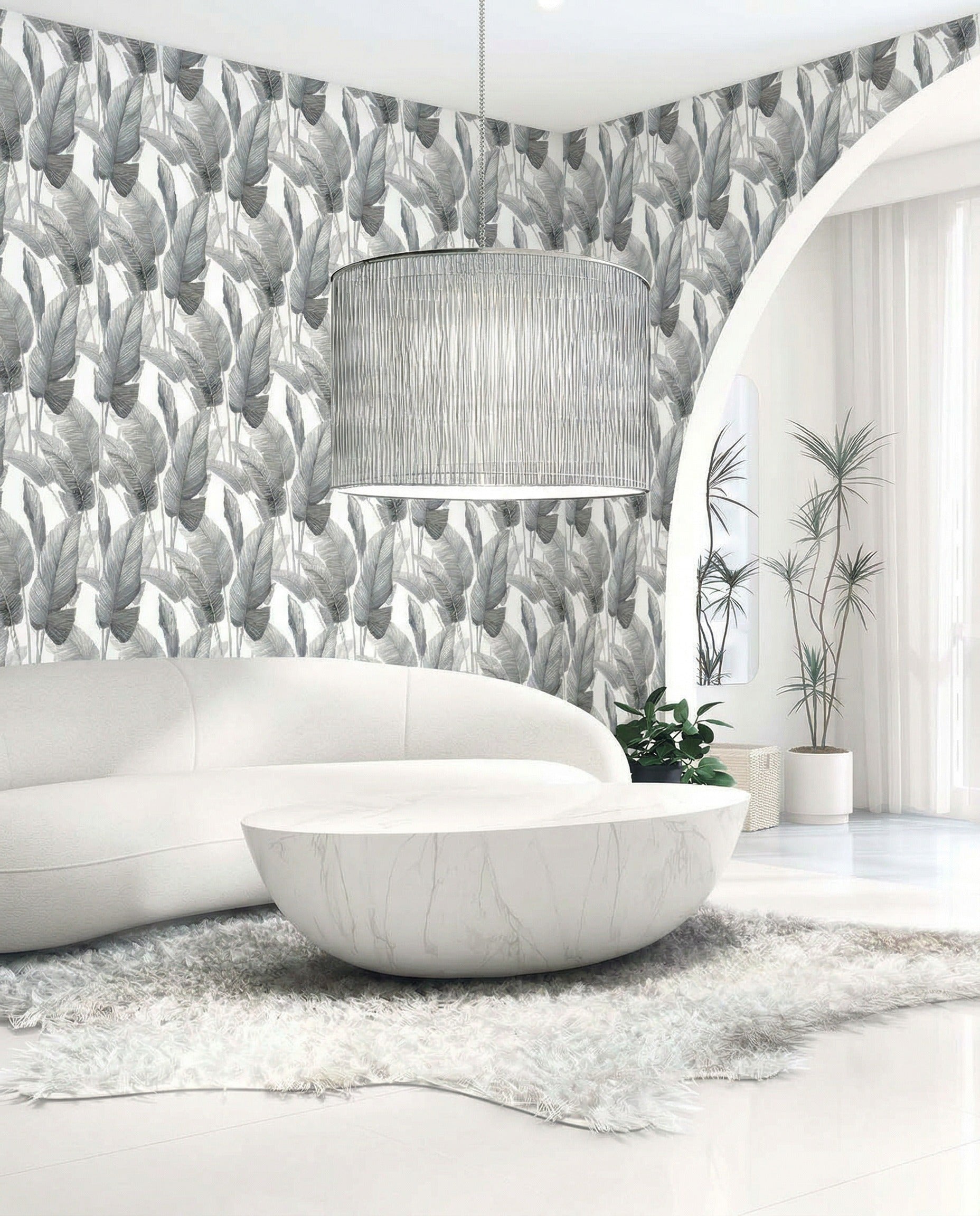 Modern living room with curved white sofa, round marble table, and Lace Leaf Wallpaper in white/off white dark gray.