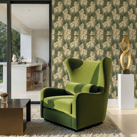 A green armchair sits by a coffee table in a stylish room with Tropical Bali Leaf Wallpaper and modern decor.