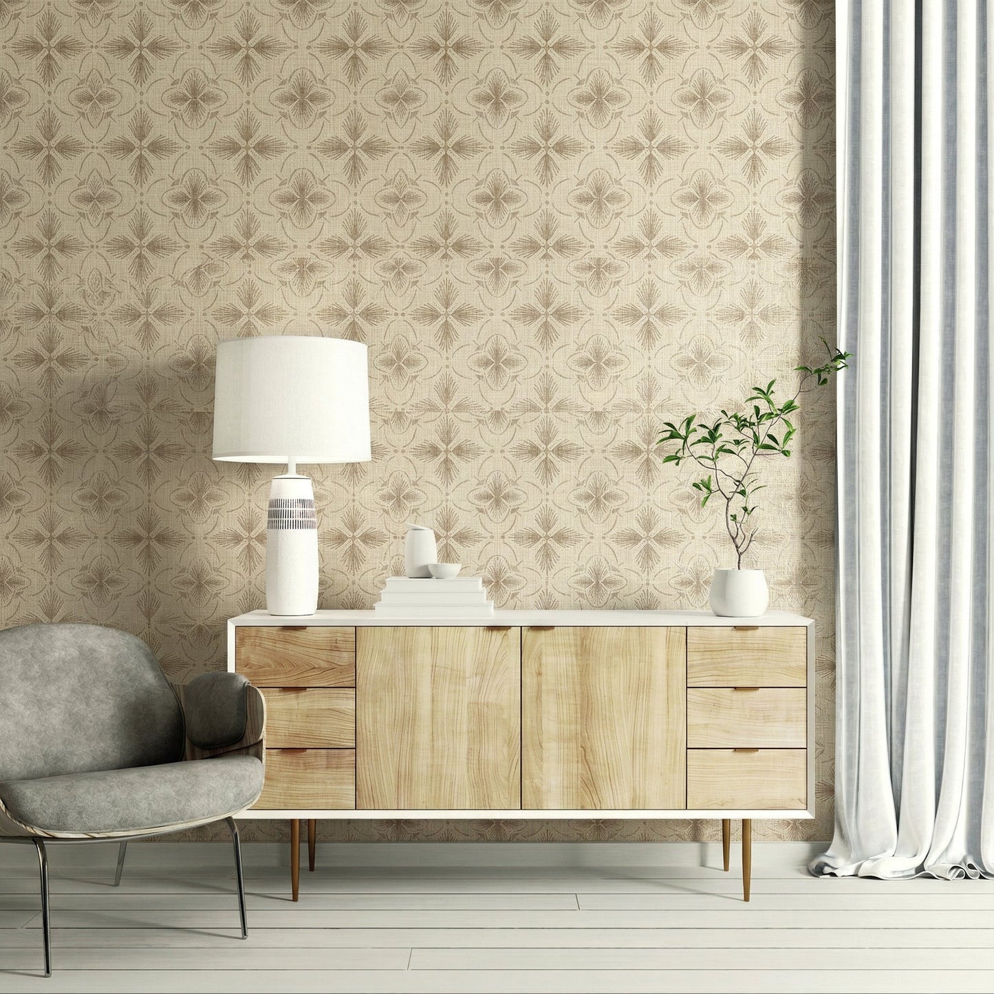 Mid-century cabinet with decor, lamp, and books by a gray chair, set against beige Tropical Bali Essence wallpaper.
