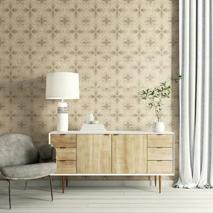 Mid-century cabinet with decor, lamp, and books by a gray chair, set against beige Tropical Bali Essence wallpaper.