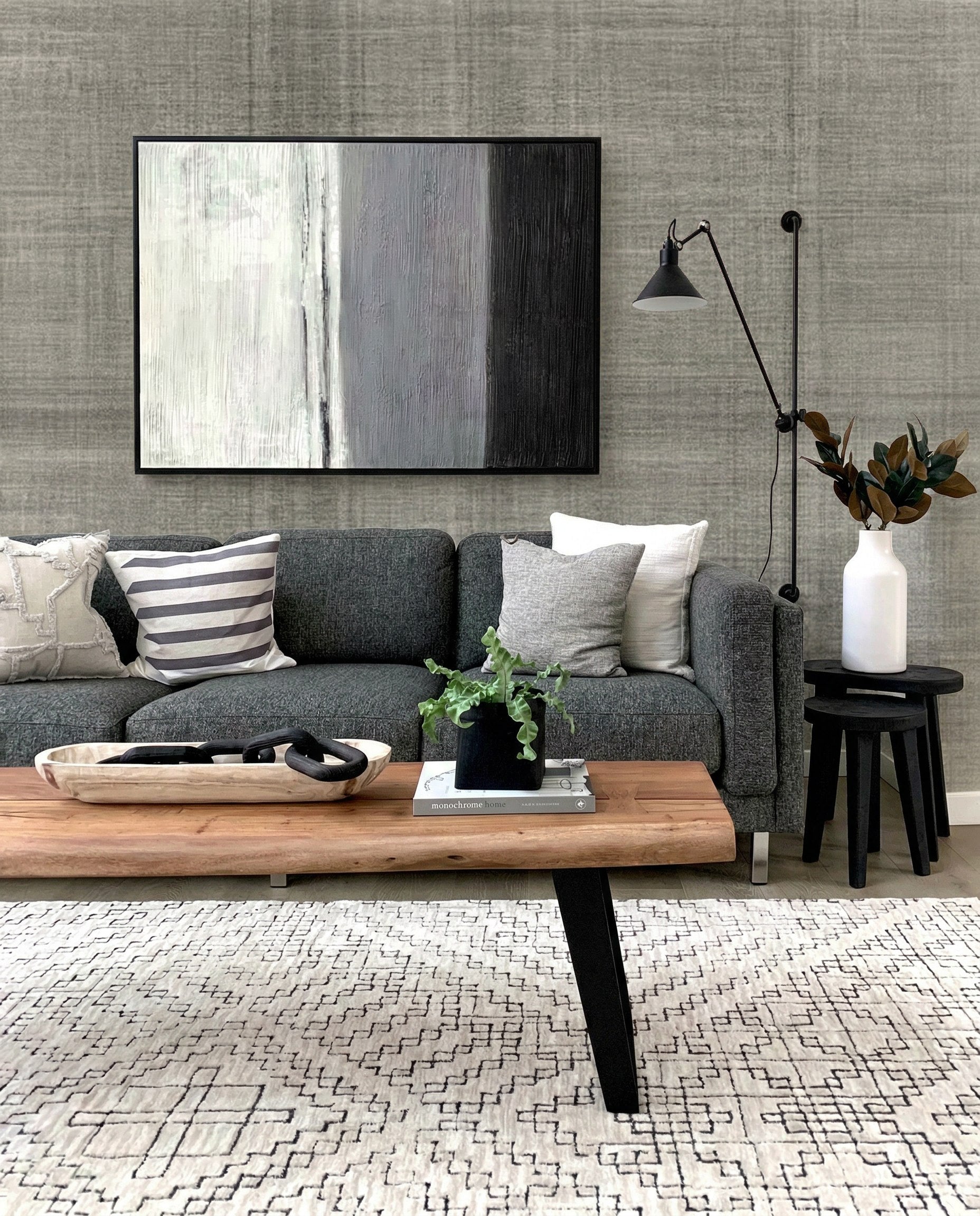 Modern living room with gray Textured Plaid Commercial Vinyl rug, gray sofa, abstract art, and neutral decor.