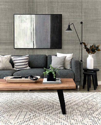 Modern living room with gray Textured Plaid Commercial Vinyl rug, gray sofa, abstract art, and neutral decor.