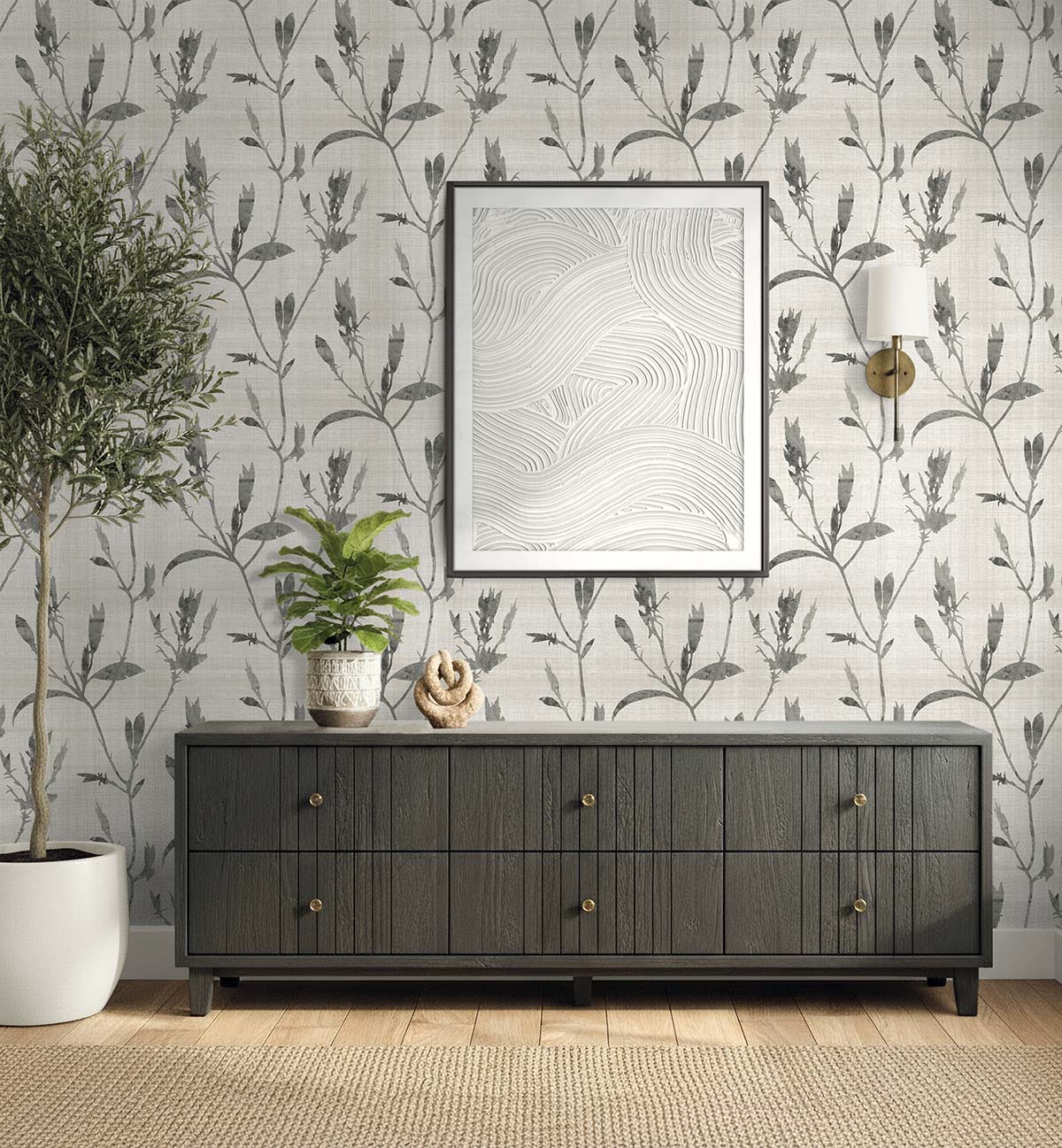A dark wood sideboard with plants and decor sits against Botanical Bali Leaf Commercial Vinyl wallpaper.
