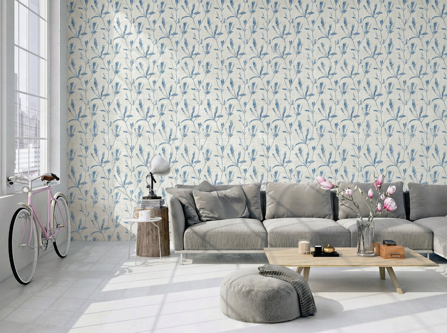 Modern living room with gray sofa, wood table, pink bike Botanical Bali Leaf Commercial Vinyl wallpaper. Sunlit windows.