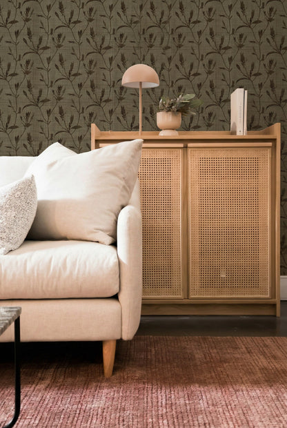 Beige sofa and wooden cabinet with lamp, book, and Botanical Bali Leaf Commercial Vinyl wallpaper on pink textured rug.