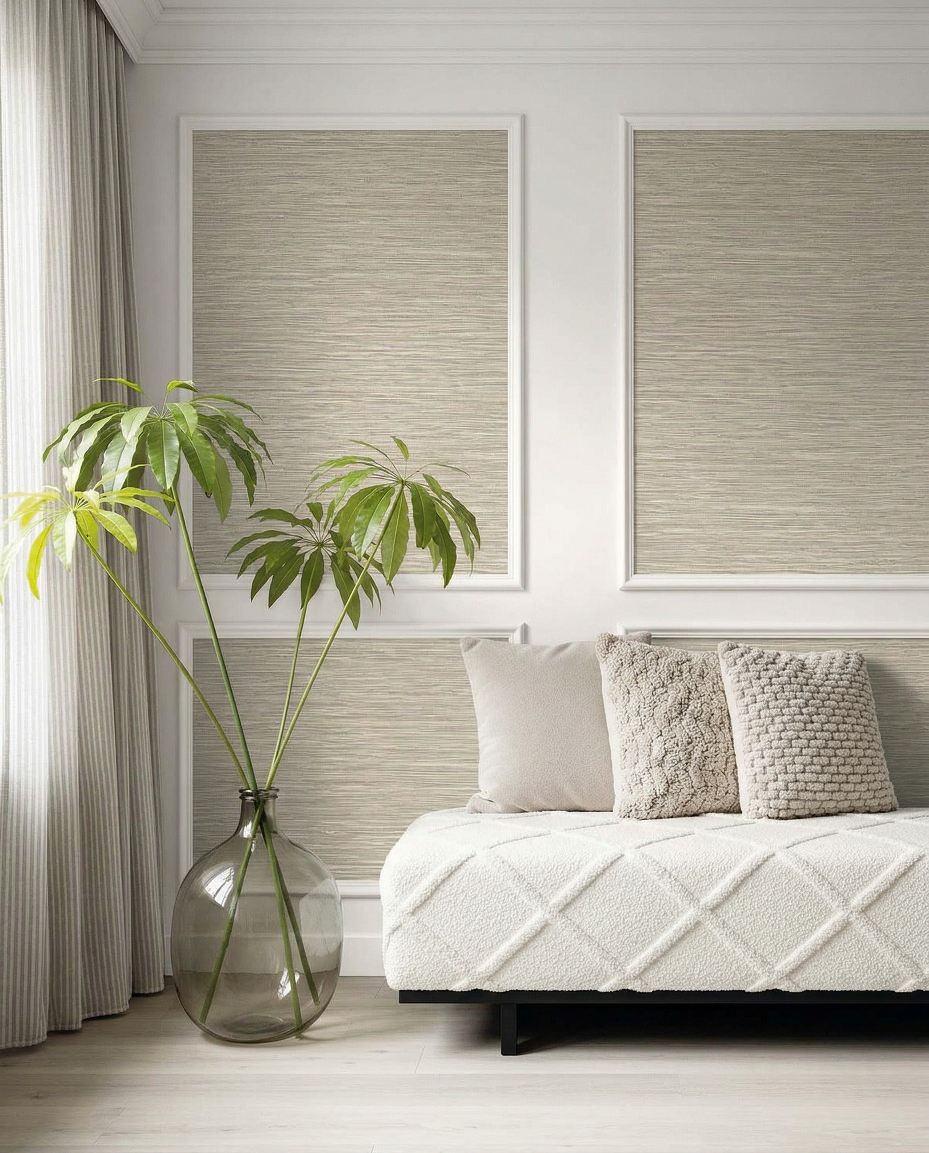 Minimalist modern space featuring Faux Grasscloth Commercial Vinyl panels, a potted plant, and a white plush couch.