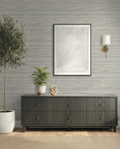 Modern entryway with a dark wood console, Faux Grasscloth Commercial Vinyl wallpaper, art, plants, and a wall sconce.