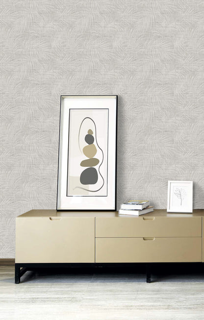 A minimalist sideboard holds abstract art, books, and a chic botanical print against Palm Grassland Commercial Vinyl.