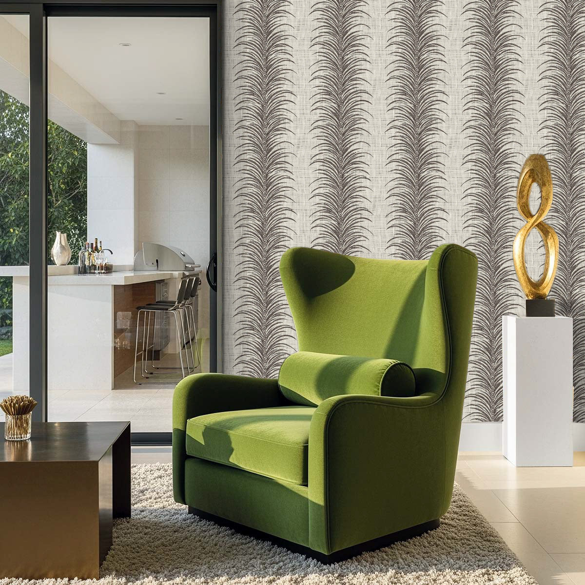A green armchair sits on a beige rug near a coffee table, with Tropical Bali Leaf Stripe Commercial Vinyl wallpaper.
