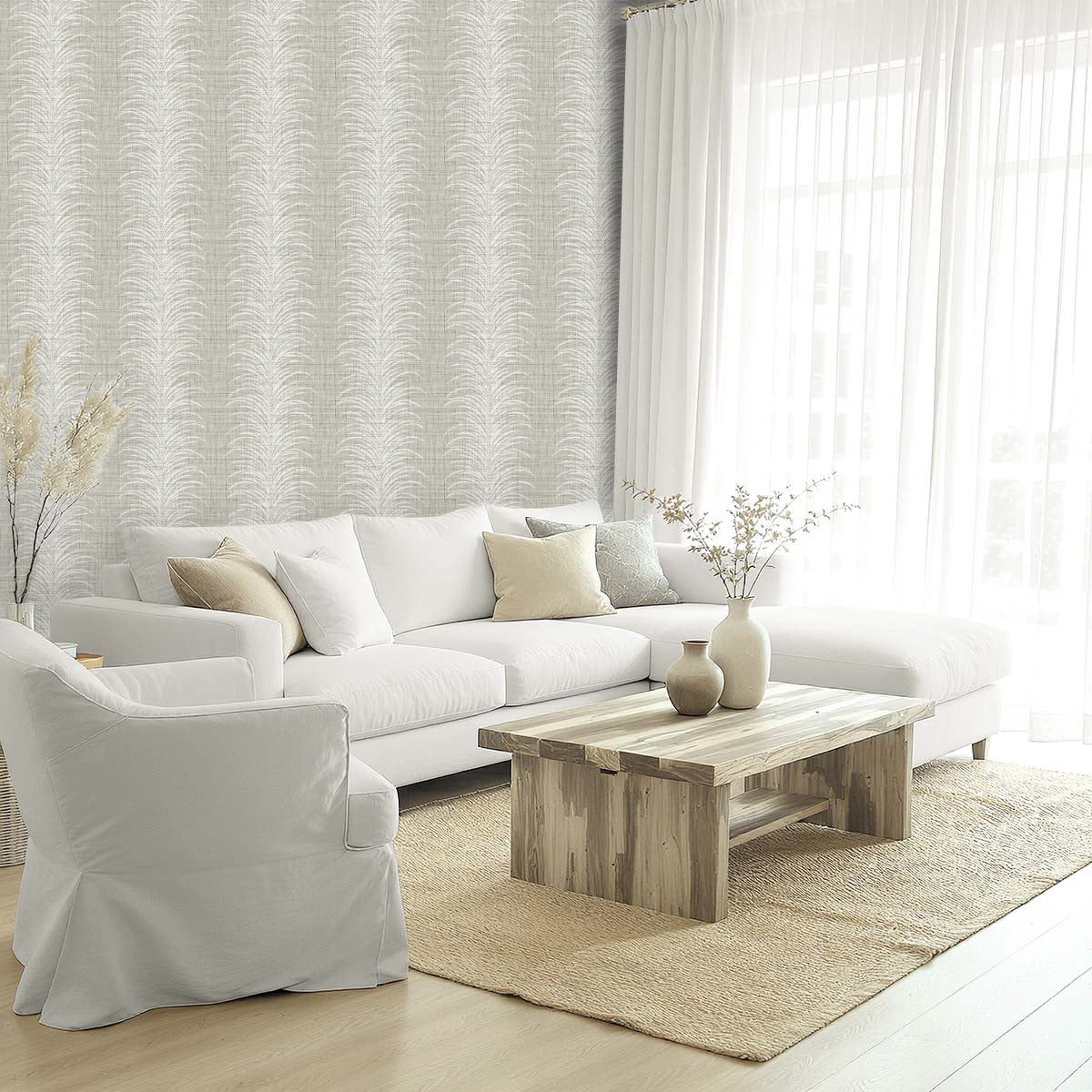 Bright modern living space with white sofa, armchair, wooden table, and windows framed by Tropical Bali Leaf Stripe Vinyl.