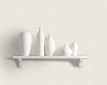 Five white ceramic vases pop on a shelf against Texture Grasscloth Effect Commercial Vinyl wallpaper.