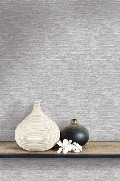Two vases with white flowers adorn a shelf, set against Texture Grasscloth Effect Commercial Vinyl wallpaper.