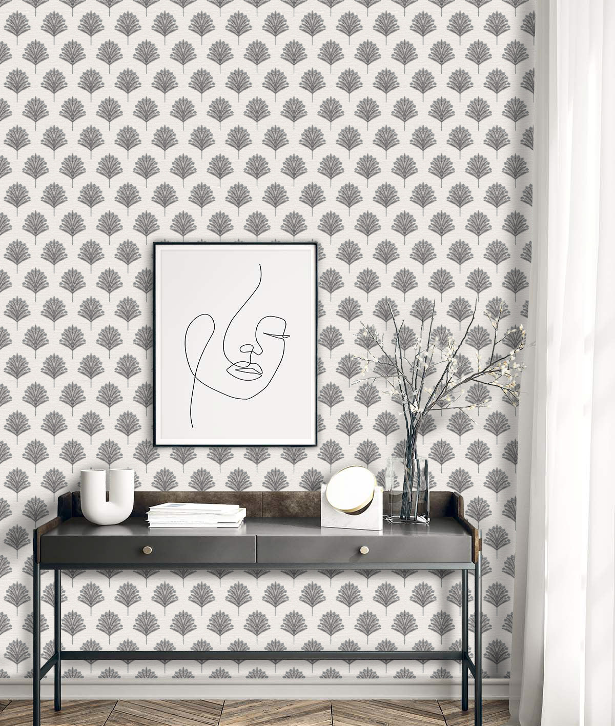 Minimalist desk with abstract face art, vase, decor, and Indian Botanical Commercial Vinyl wallpaper.