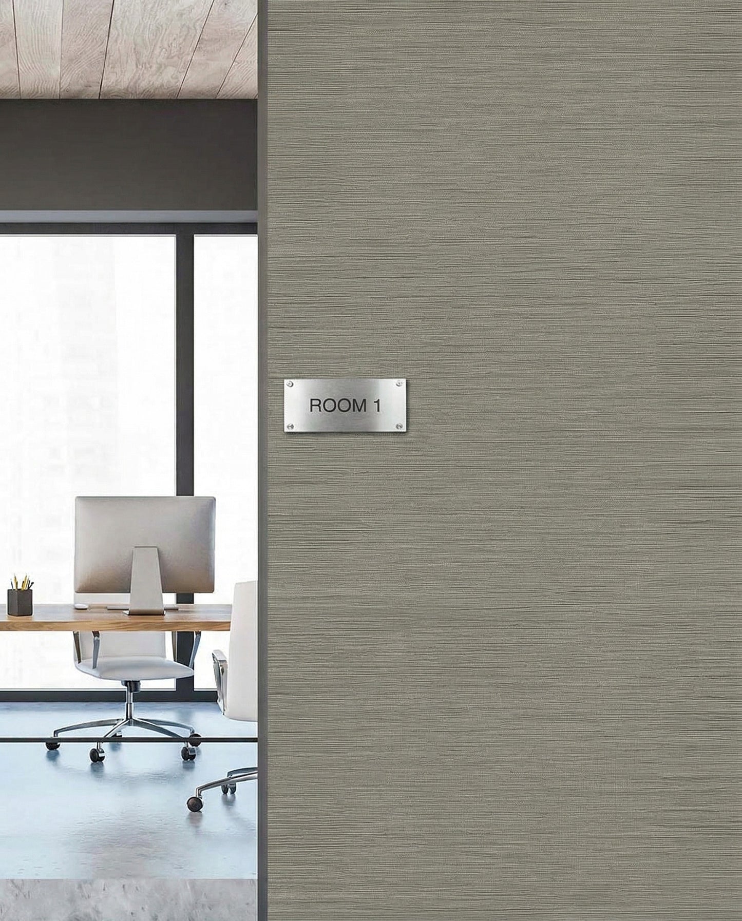 Office with modern furniture seen through Room 1 door, featuring Grasslands Commercial Vinyl wallcovering.