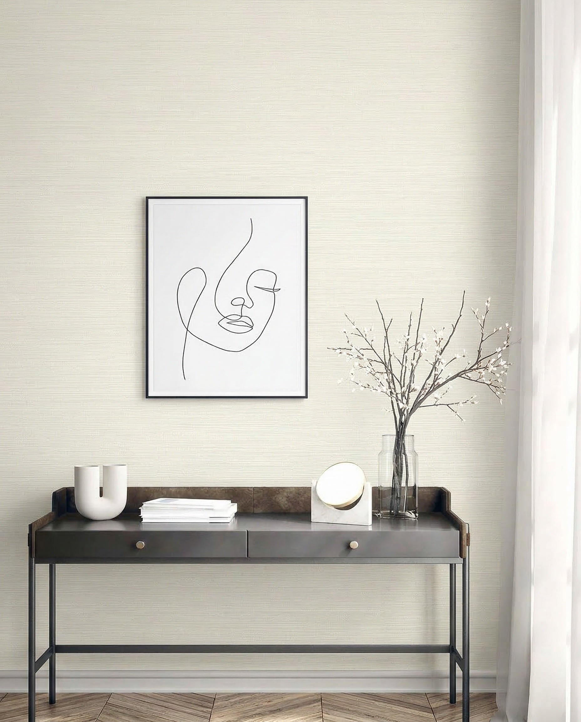Minimalist desk with decor, framed abstract face art, and Grasslands Commercial Vinyl wallcovering by window.