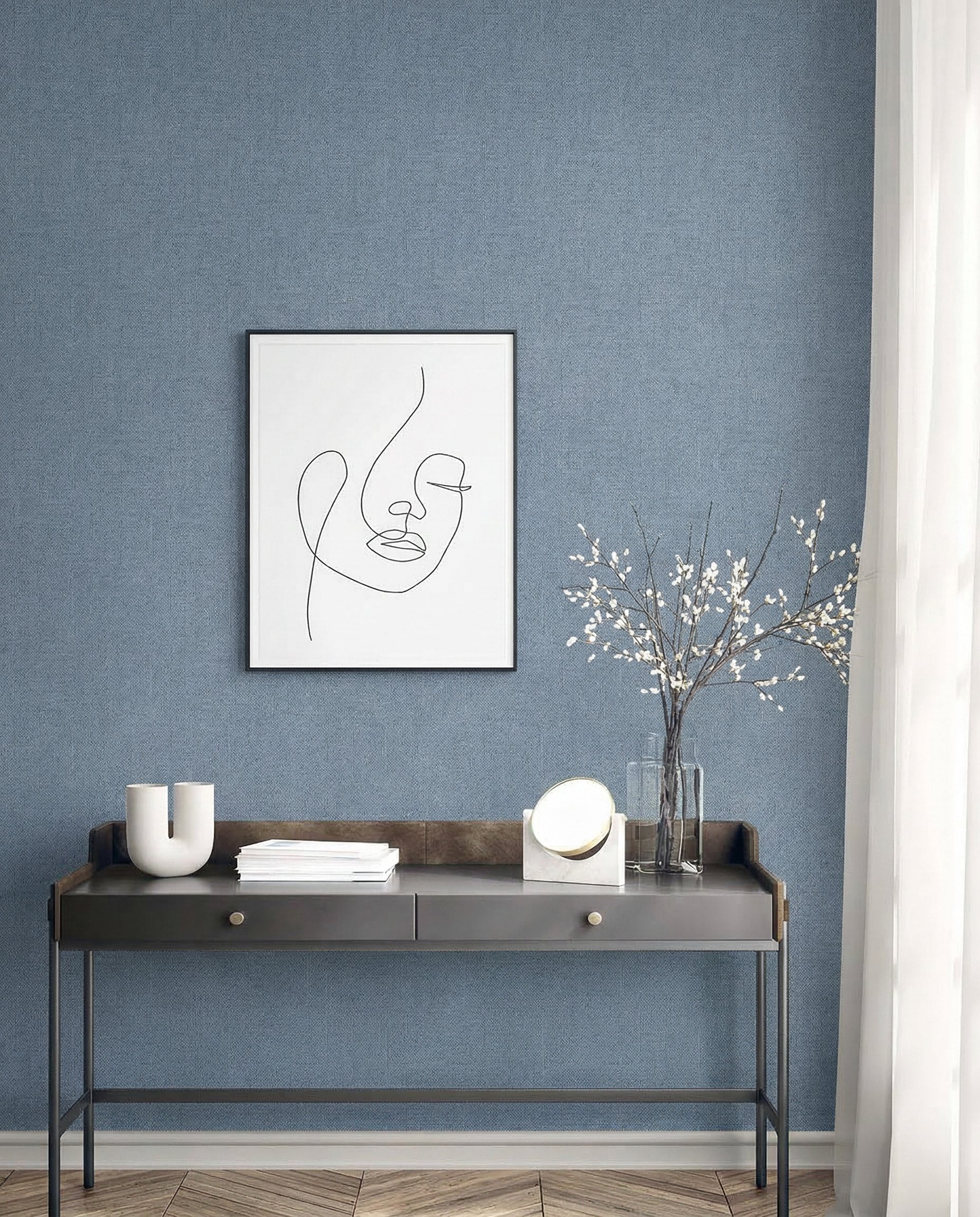 A modern console table with decor sits below abstract line art on Faux Paperweave Commercial Vinyl wallpaper by sheer windows.