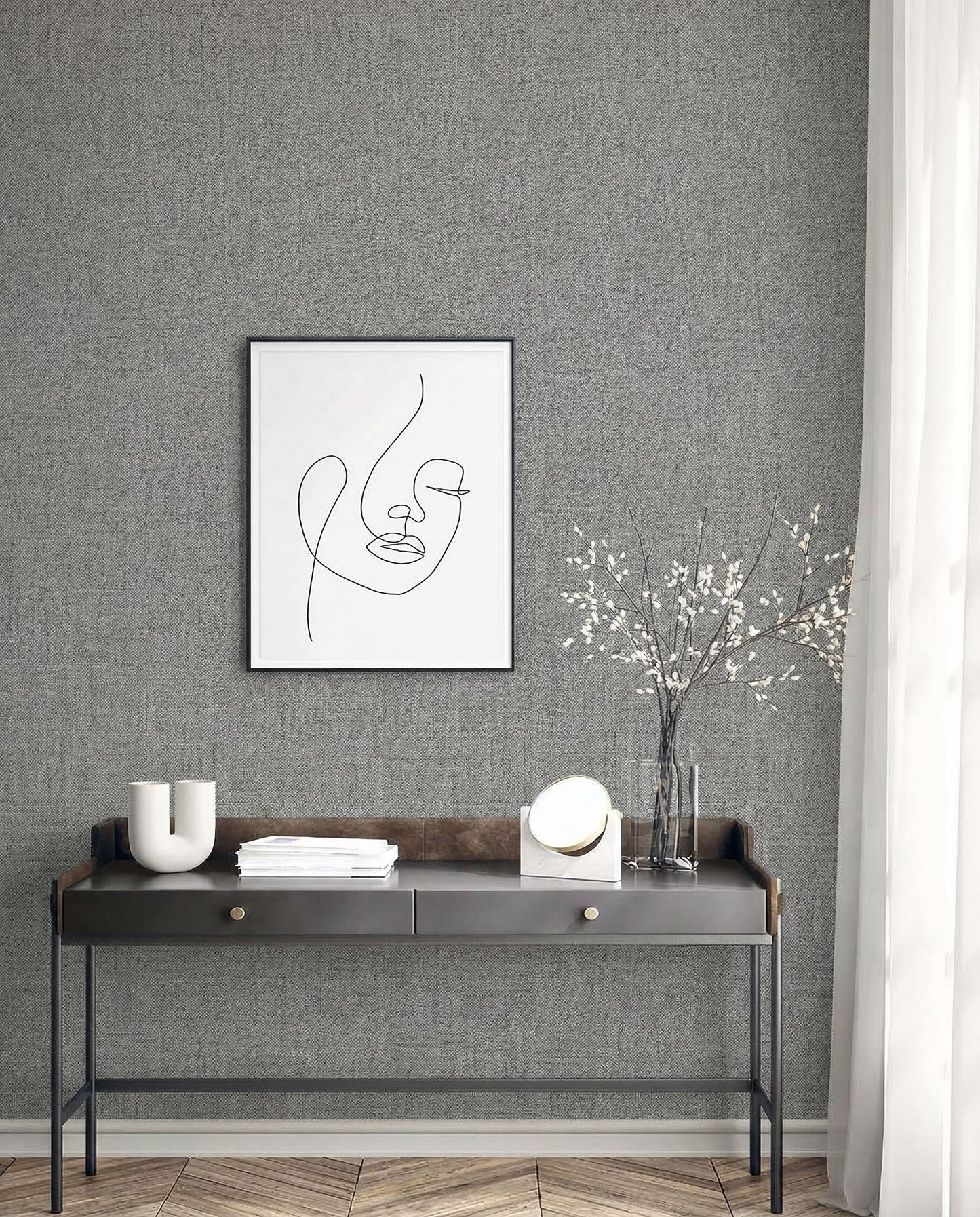 Minimalist console table with decor beneath framed abstract line art on Faux Paperweave Commercial Vinyl wallpaper.