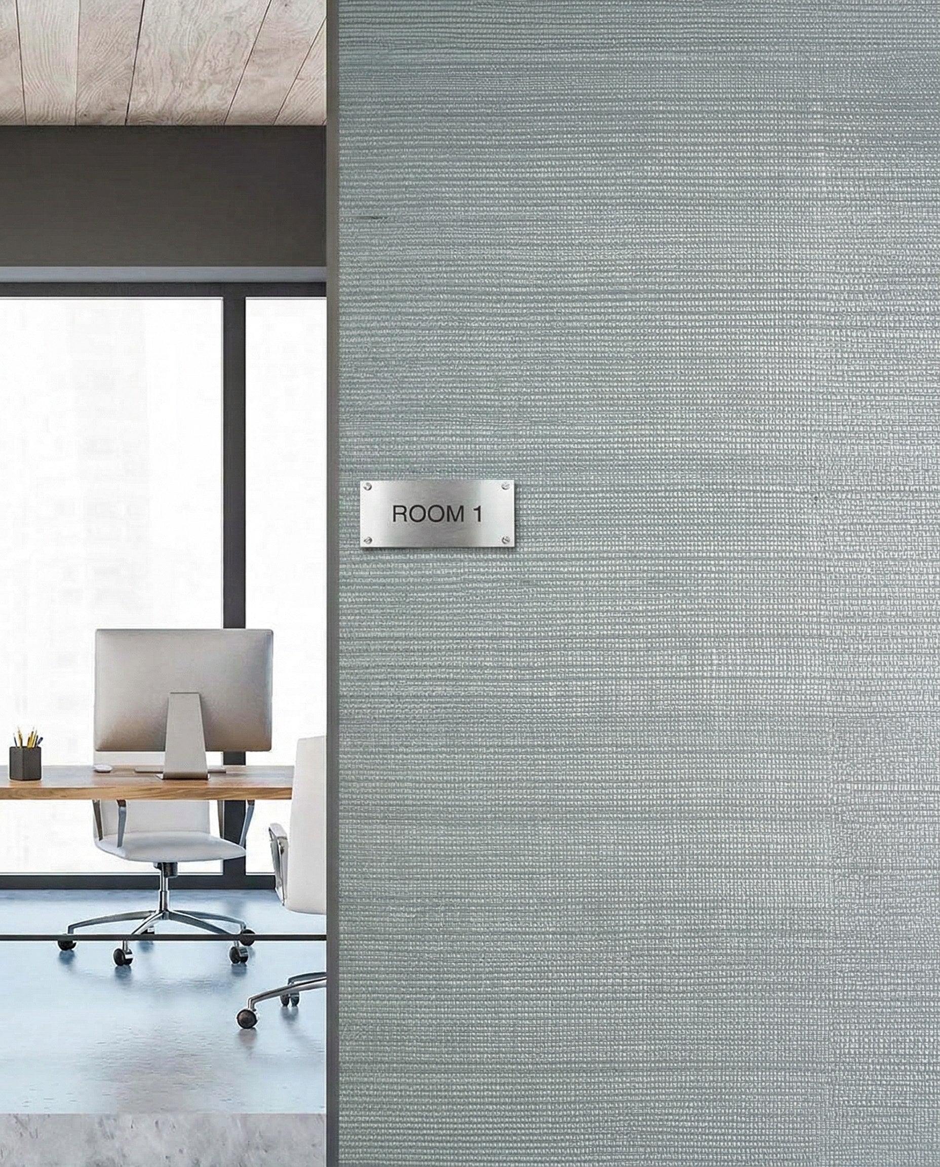 Modern office with a desk and chair, featuring Sisal Texture Grasscloth Naturals wallpaper on a textured gray wall.