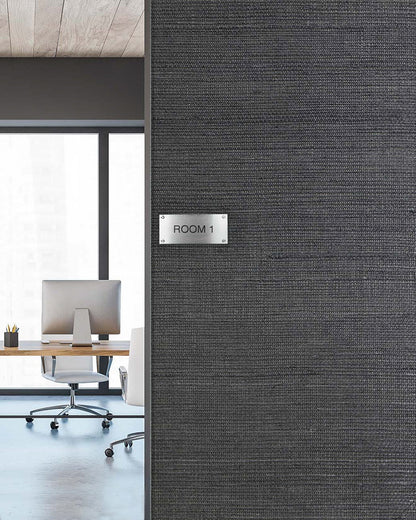 A modern office with desks and chairs seen through a doorway labeled Room 1 on Sisal Texture Grasscloth Naturals.