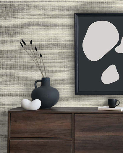 A modern dresser with a black vase, abstract art, and cup stands out against Sisal Texture Grasscloth Naturals.