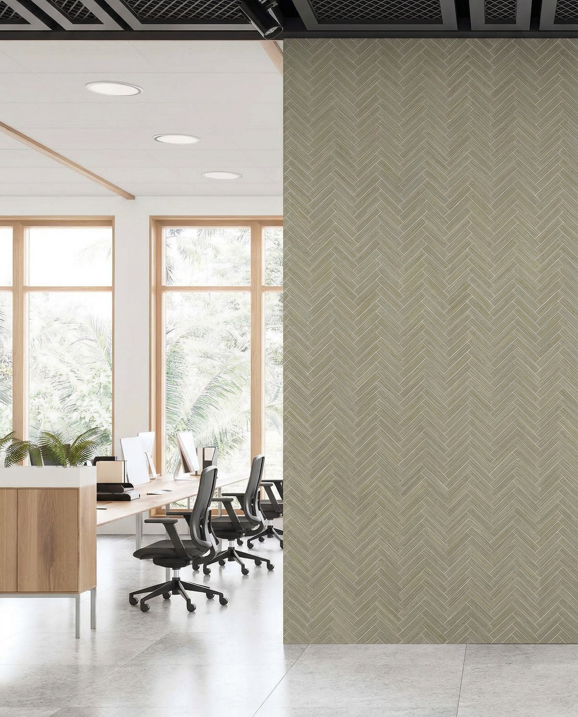 Modern office with desks and chairs by windows, divided by Herringbone Raffia Grasscloth Naturals wallcovering.