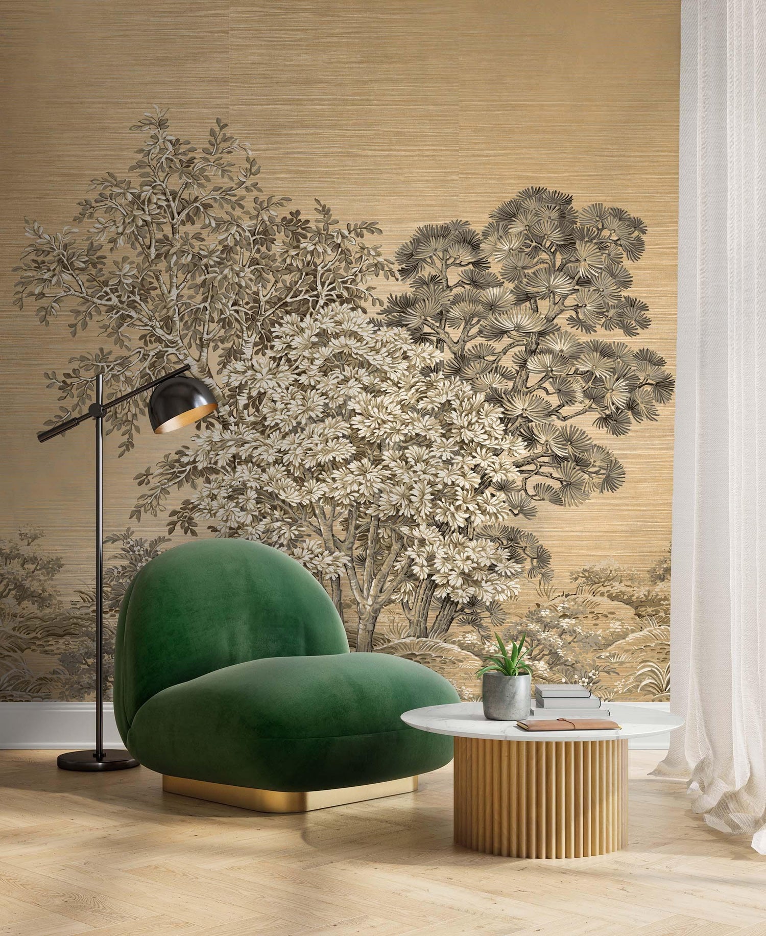 Green velvet chair, round coffee table, lamp, and a Painted Trees Murals accent in a modern living room with wood floors.