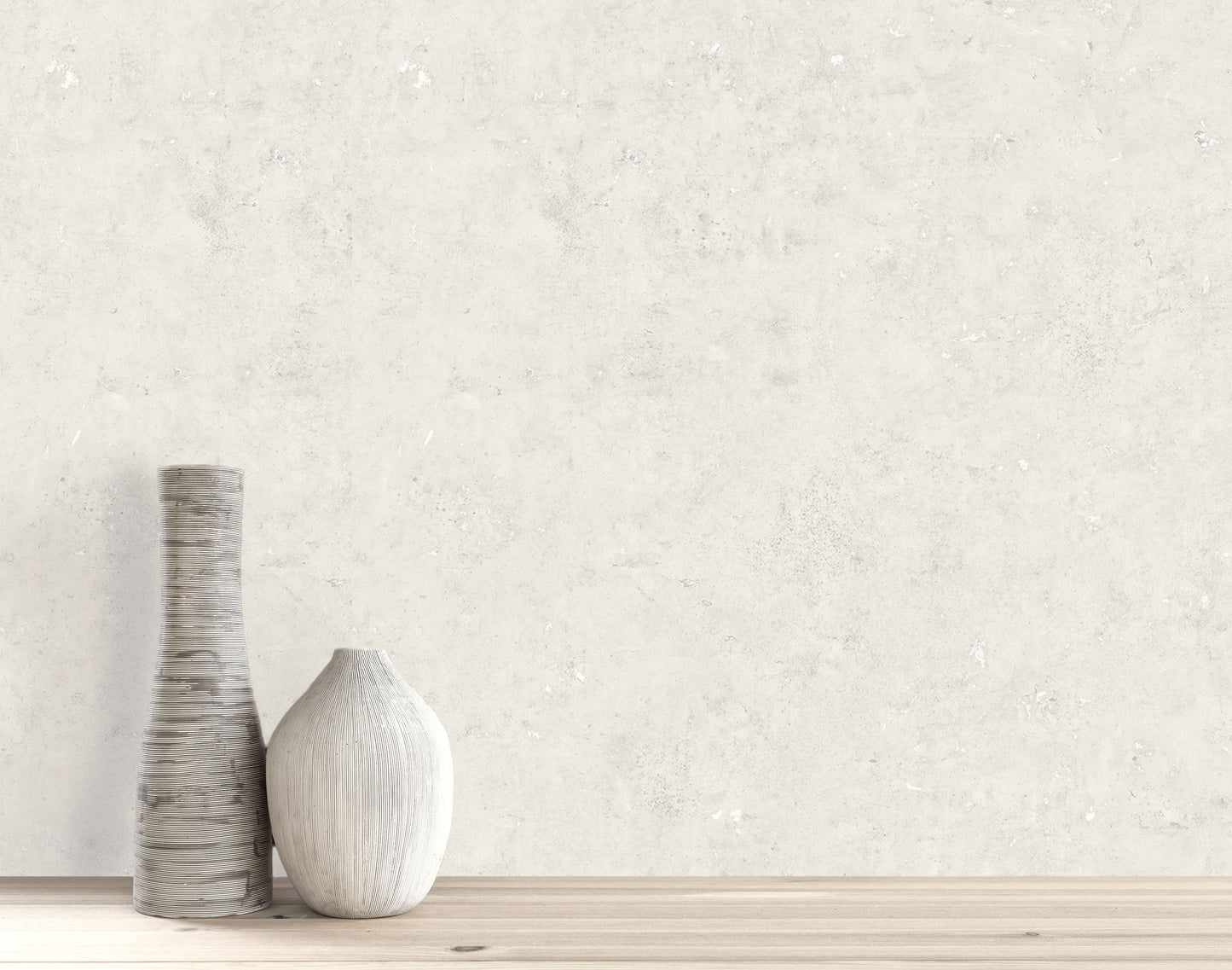 Two decorative vases on wood with Cement Commercial Vinyl faux unpasted wallpaper as a light, textured backdrop.