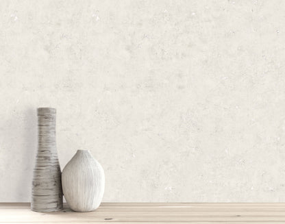 Two decorative vases on wood with Cement Commercial Vinyl faux unpasted wallpaper as a light, textured backdrop.