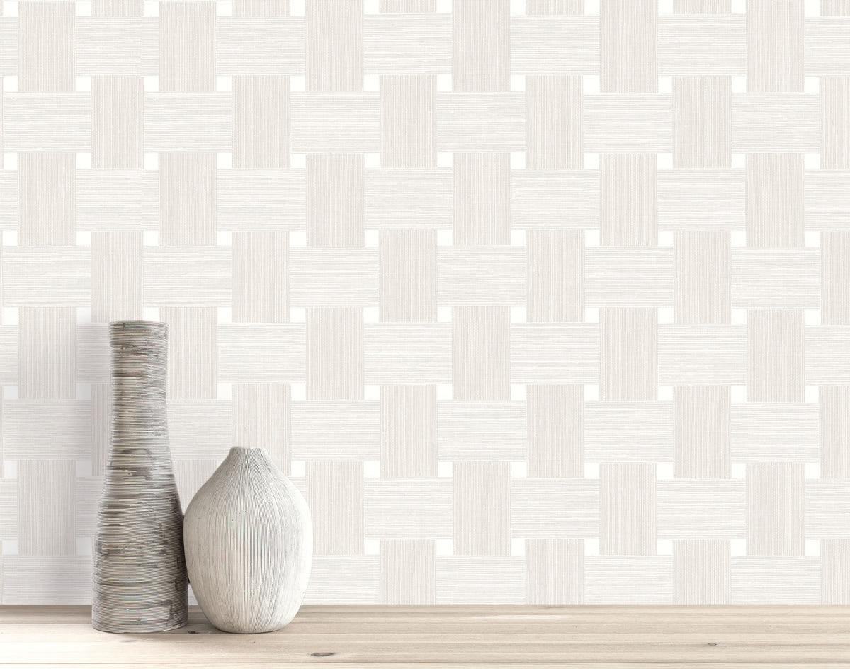 Two decorative vases on wood set against Basket Weave Commercial Vinyl wallcoverings with a geometric pattern.