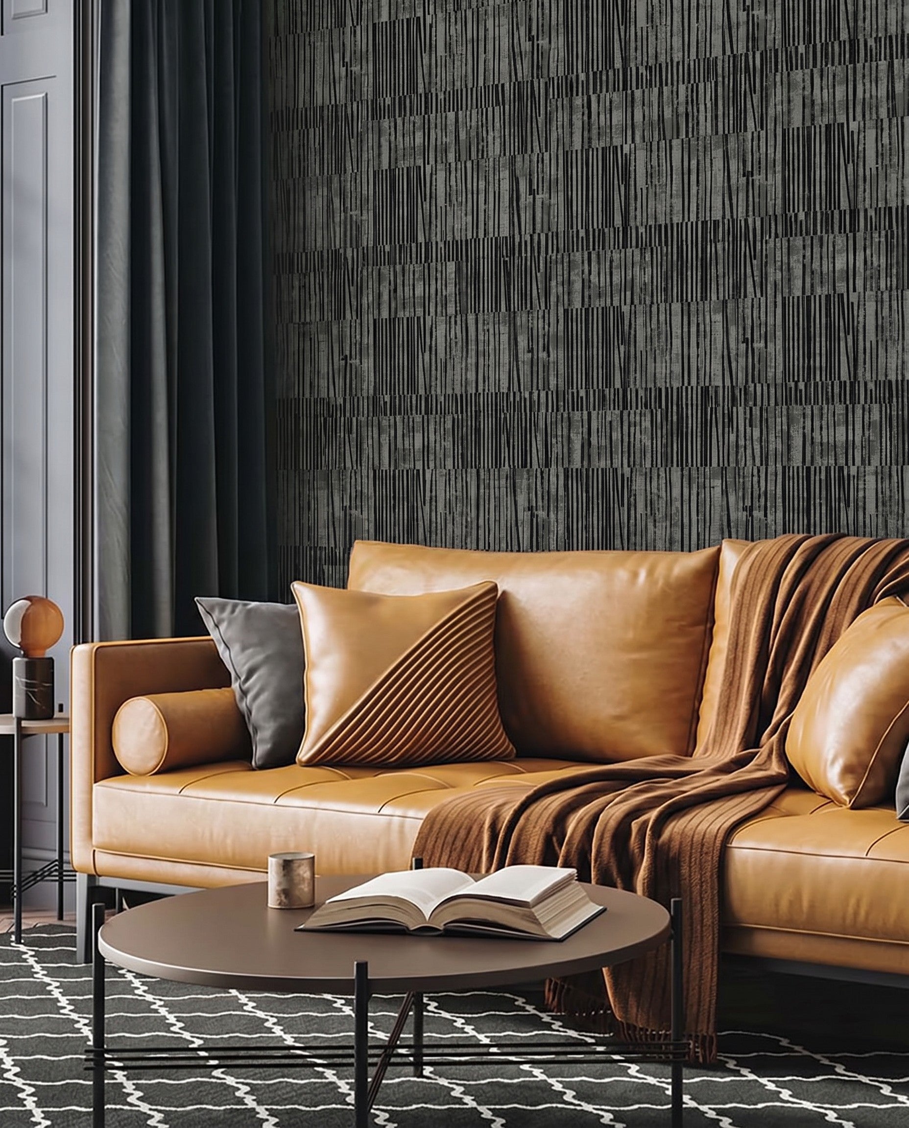 Tan leather sofa with cushions, round coffee table, and Abstract Vertical Stripes Wallpaper in a modern living room.