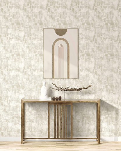 A minimalist wooden console table with decor, abstract art, and Distressed Faux Wallpaper on a light wall.