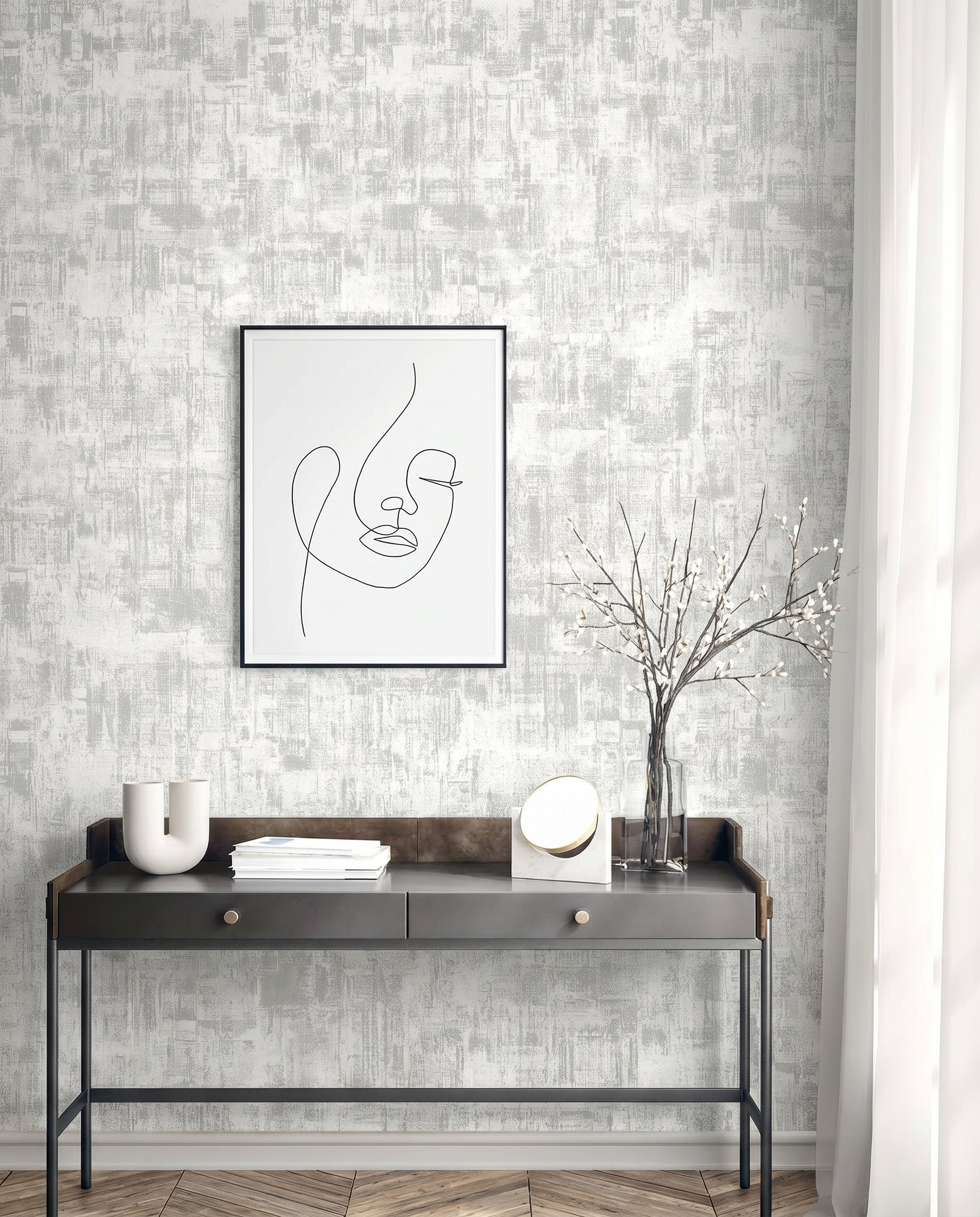 Minimalist console table with vases, mirror, and books under line art on Distressed Faux Wallpaper in textured gray.