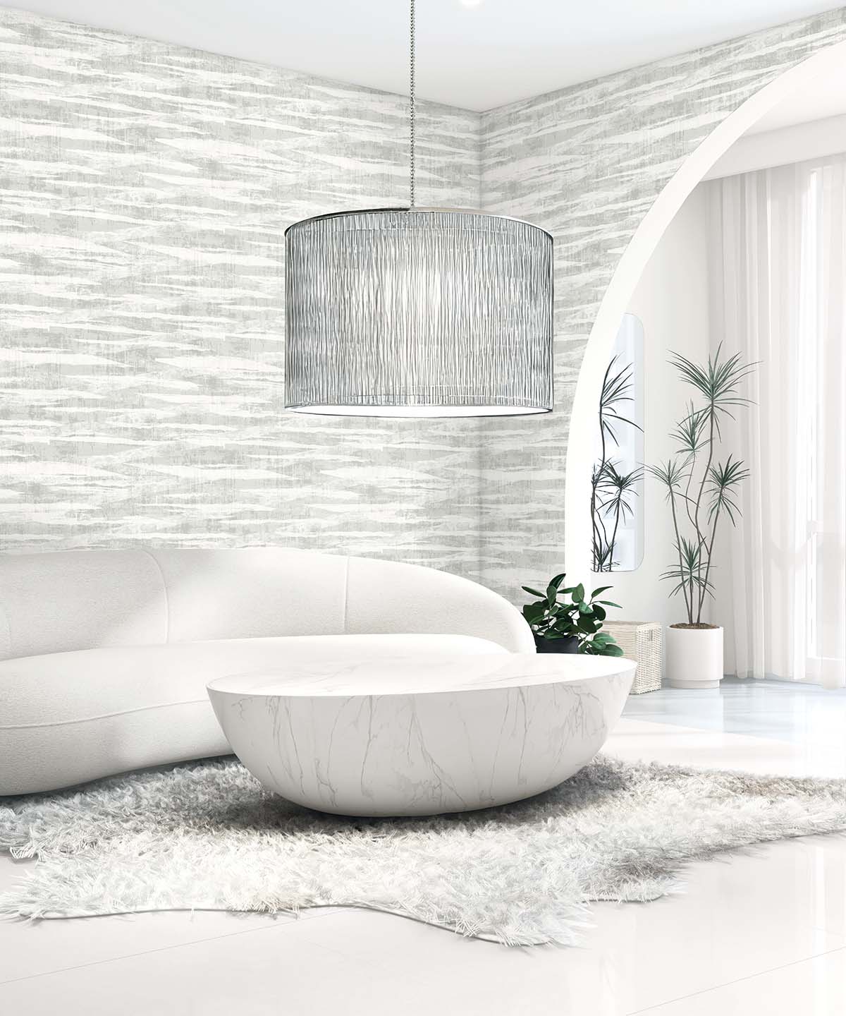 Modern living room with a curved white sofa, round coffee table, gray rug, plants, and Stone Nebulite Wallpaper accents.