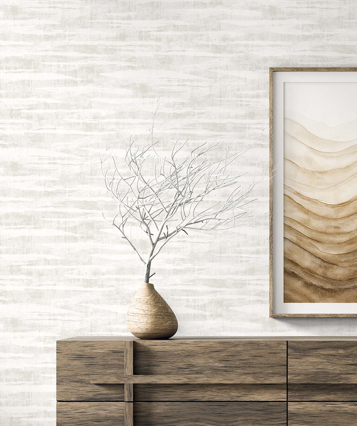 A minimalist wooden dresser with a bare branch in a vase and abstract art on Stone Nebulite Wallpaper.