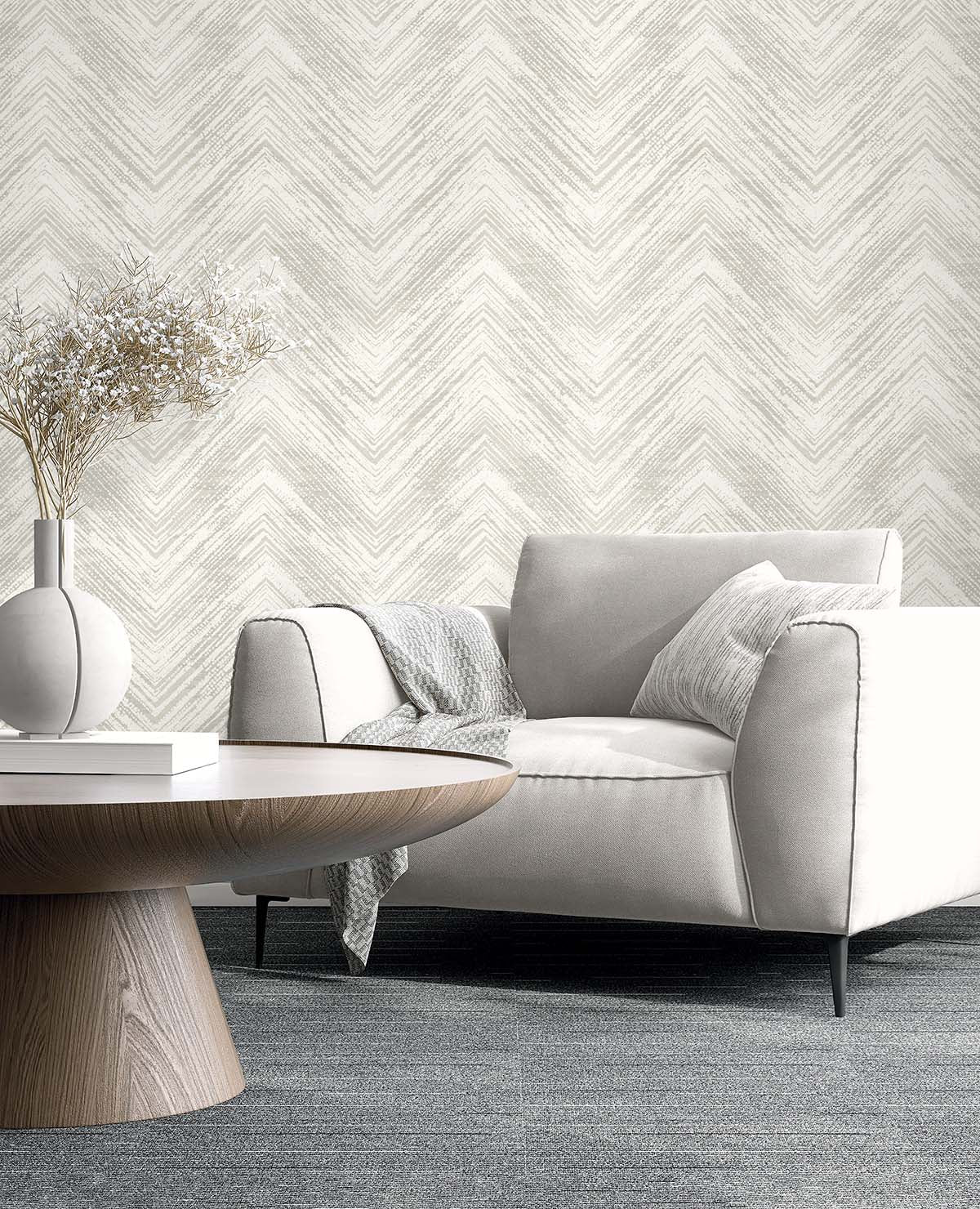 Modern living room with a white armchair and beige Chevron Wallpaper that's washable for easy upkeep.